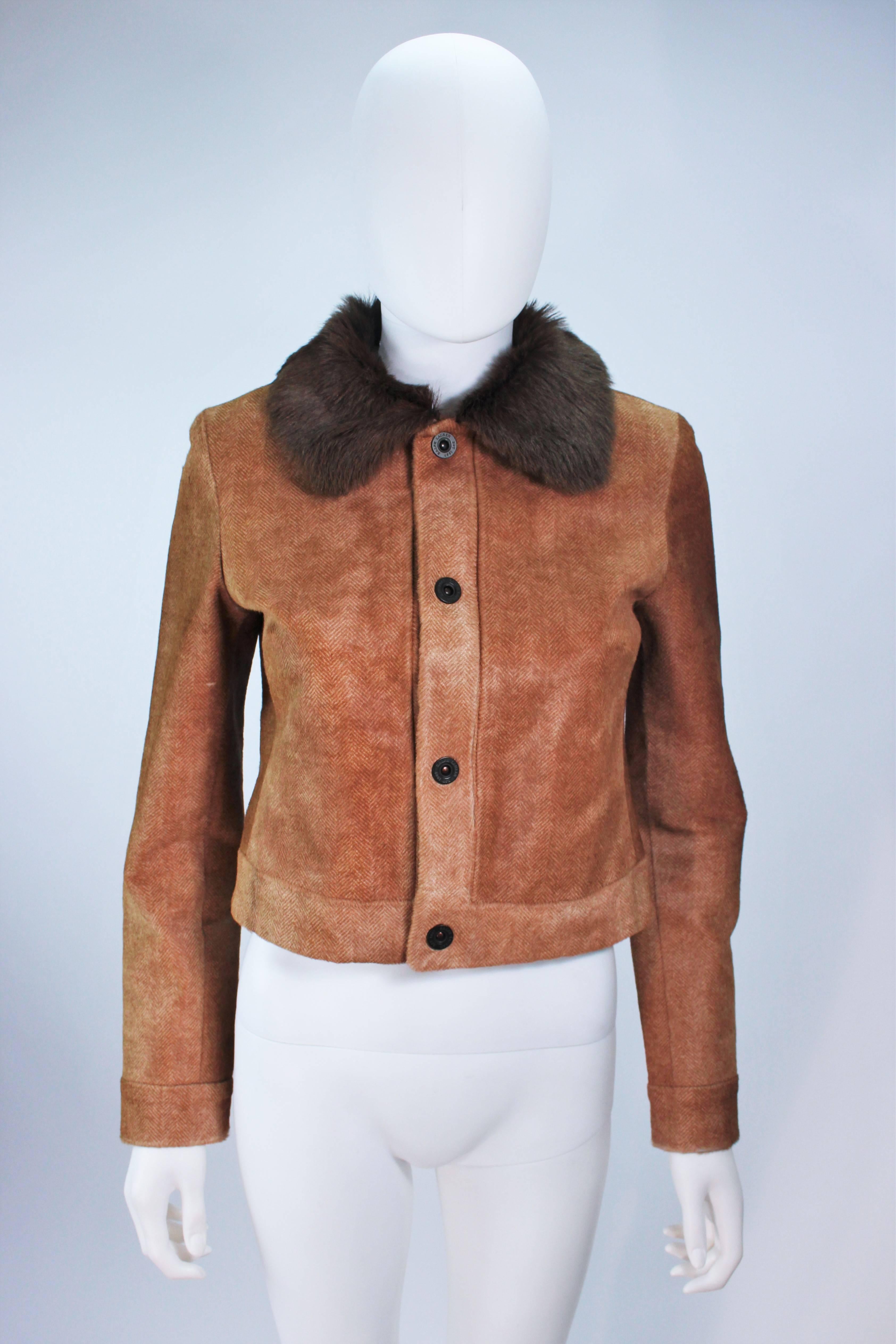 This Ralph Lauren  jacket is composed of a sheared chevron patterned cowhide with fur collar trim. There are center front snap closures. In excellent condition, some natural variations in fur, hardly used. 

  **Please cross-reference measurements