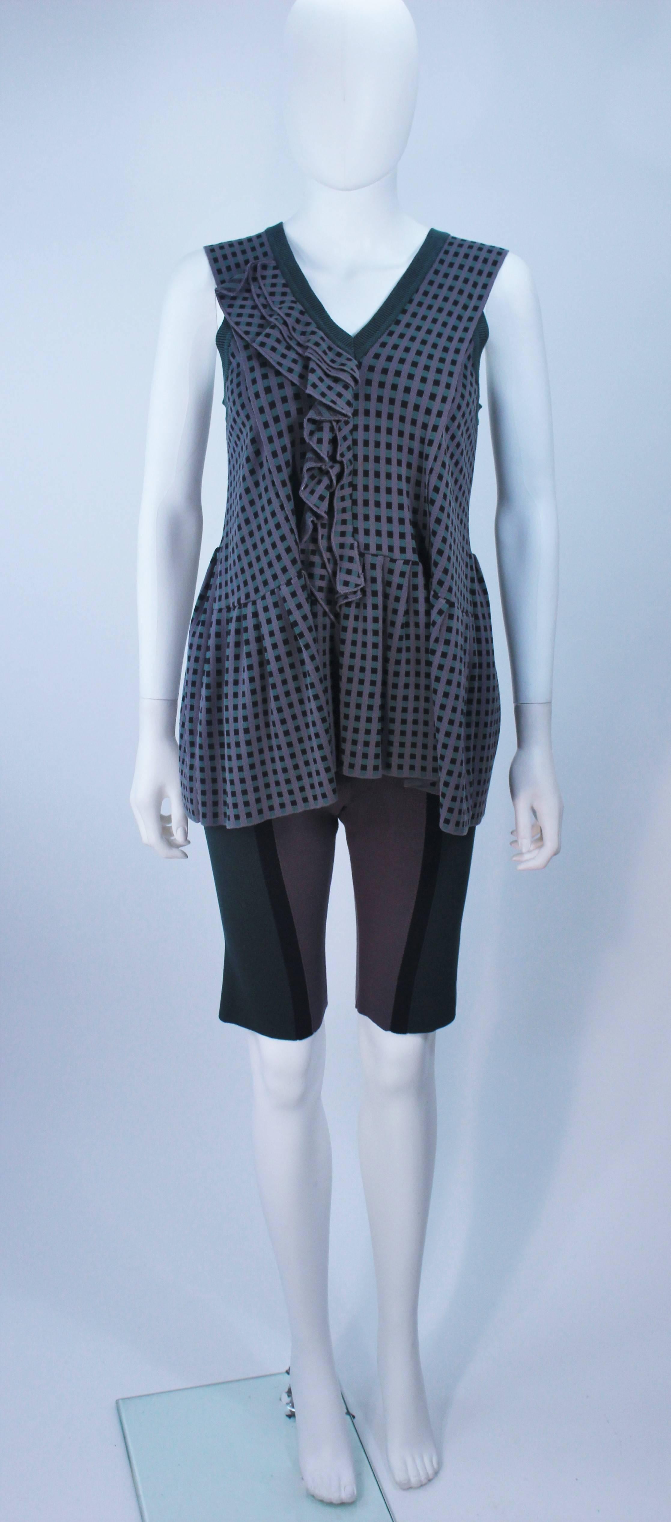 This Marni  set is composed of a stretch knit in grey, green, and mauve hues. The top features a draped sleeveless style. The shorts are a bike length. In excellent condition. 

  **Please cross-reference measurements for personal accuracy. 