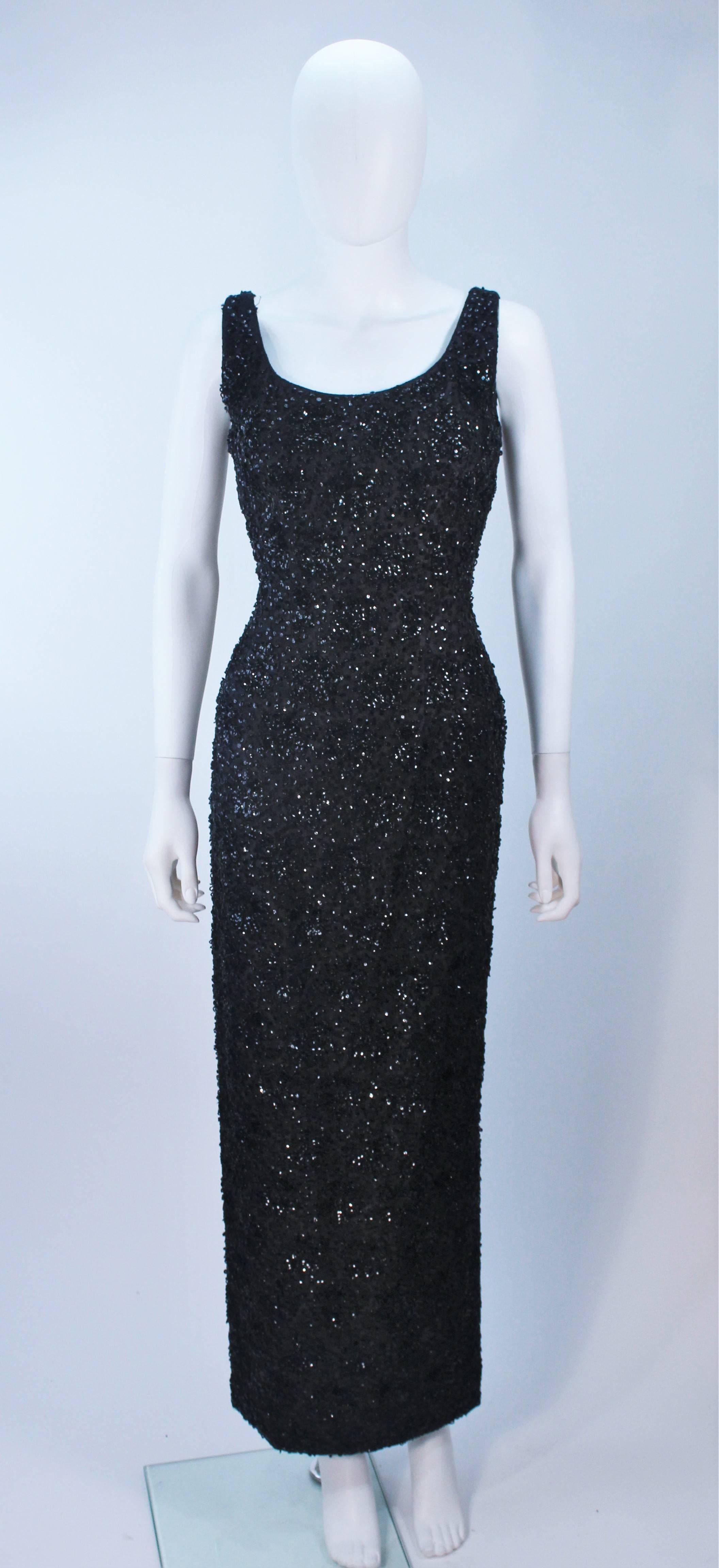 This Haute Couture International  gown is composed of a black beaded and sequin lace. There is a side slit and center back zipper closure. In excellent vintage condition. 

  **Please cross-reference measurements for personal accuracy. Size in