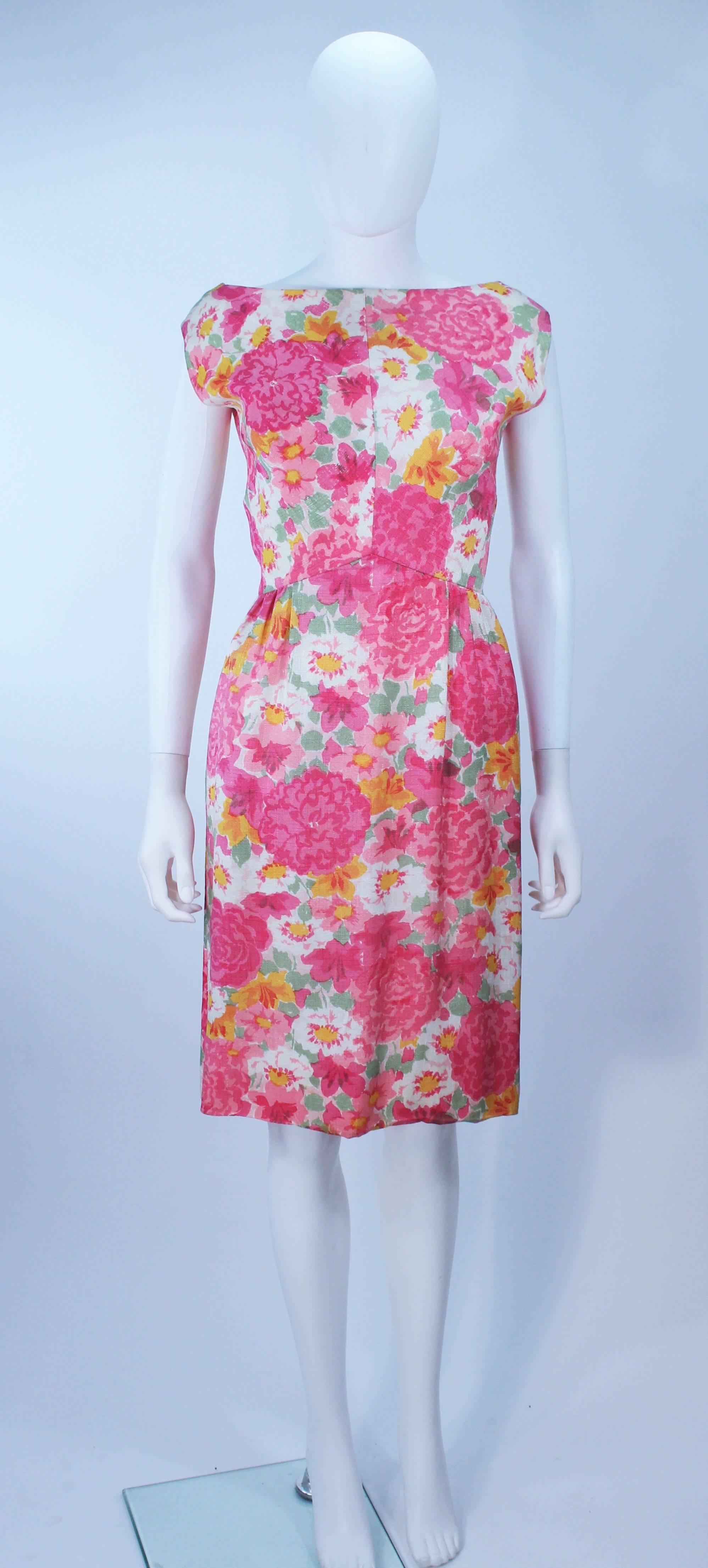  This dress is composed of a white silk with floral print. There is a center back zipper closure with a bow accent and v-back. In excellent vintage condition.

  **Please cross-reference measurements for personal accuracy. Size in description box