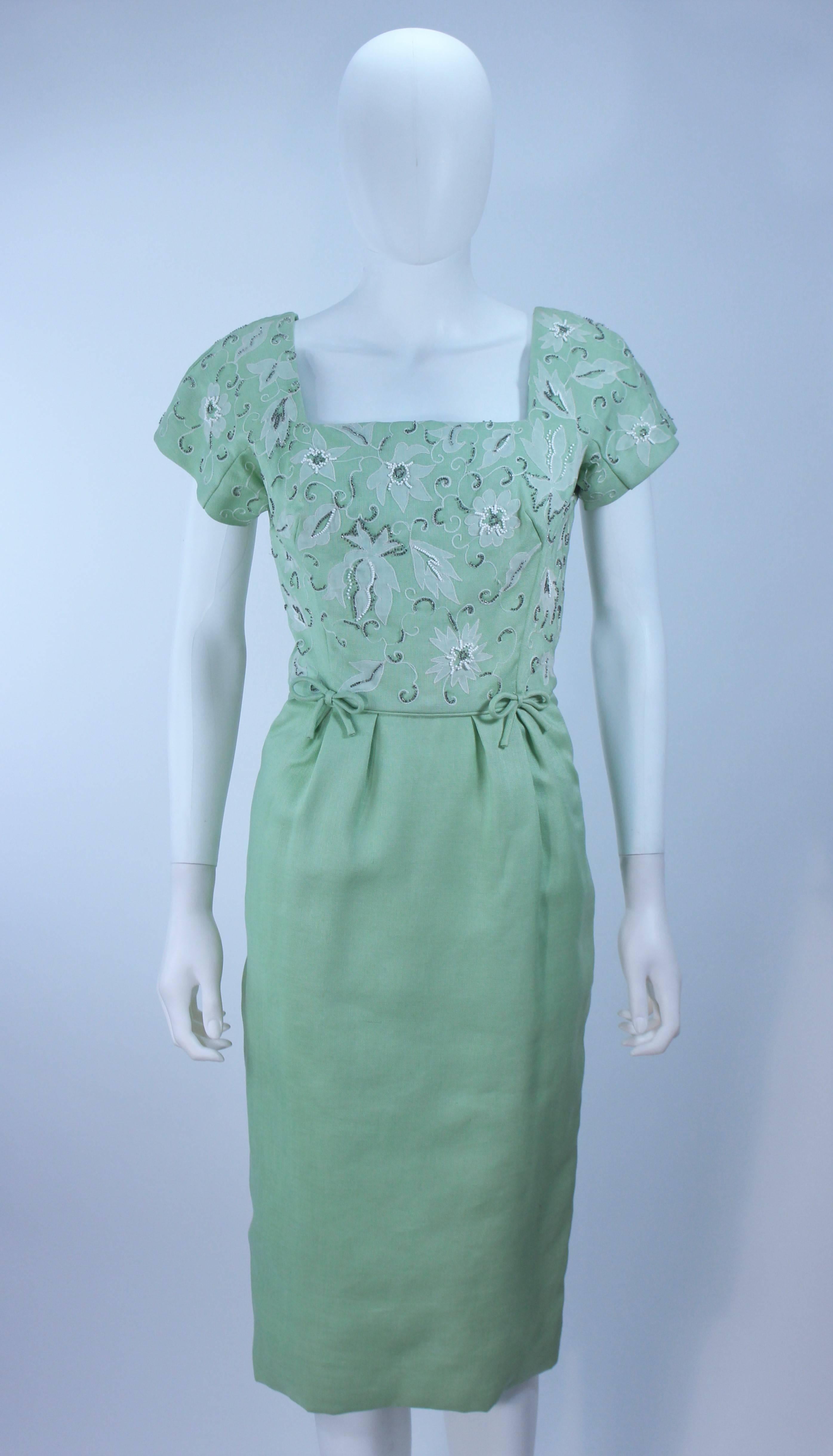 sage green dress with white flowers