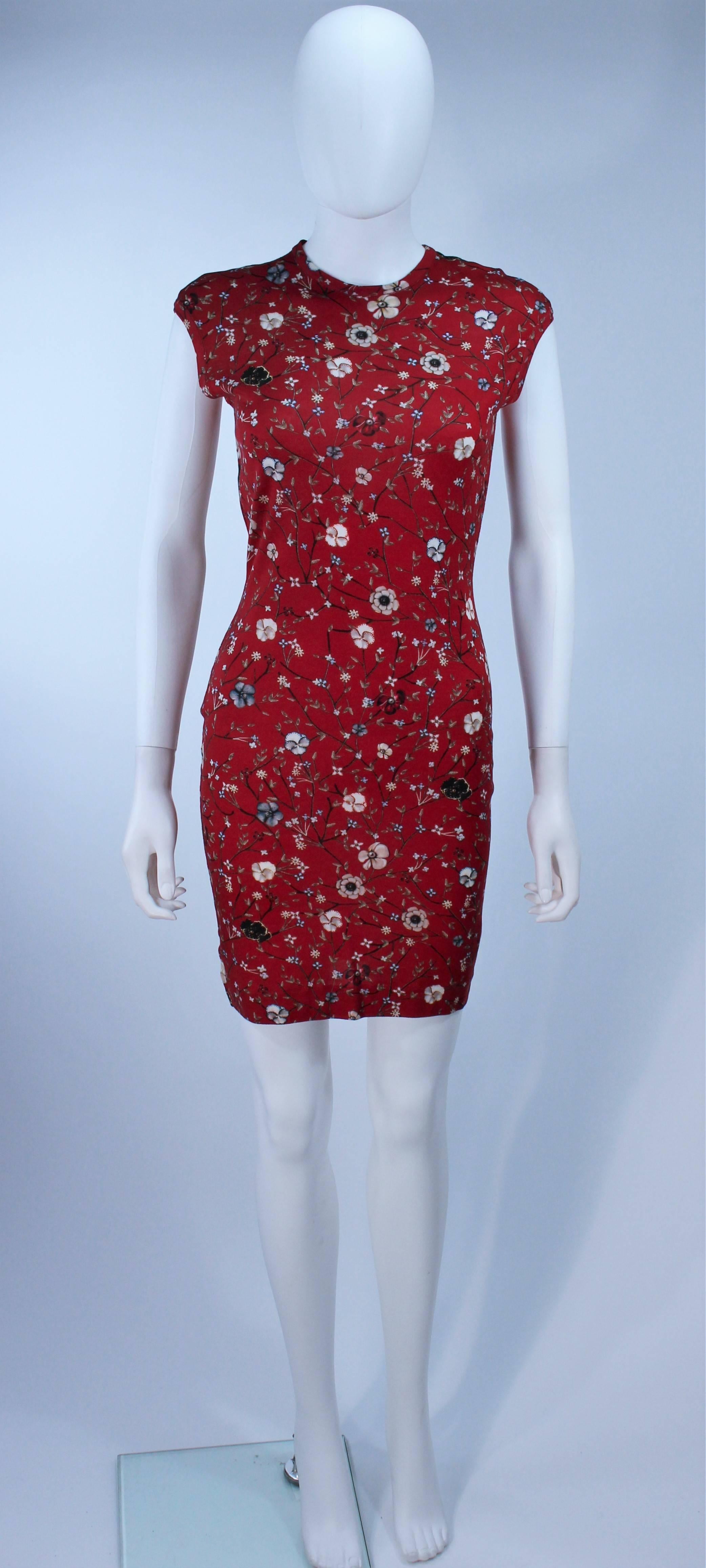 This Alexander McQueen design is available for viewing at our Beverly Hills Boutique. We offer a large selection of evening gowns and luxury garments. 

 This dress is composed of a light weight stretch floral print wool. In excellent
