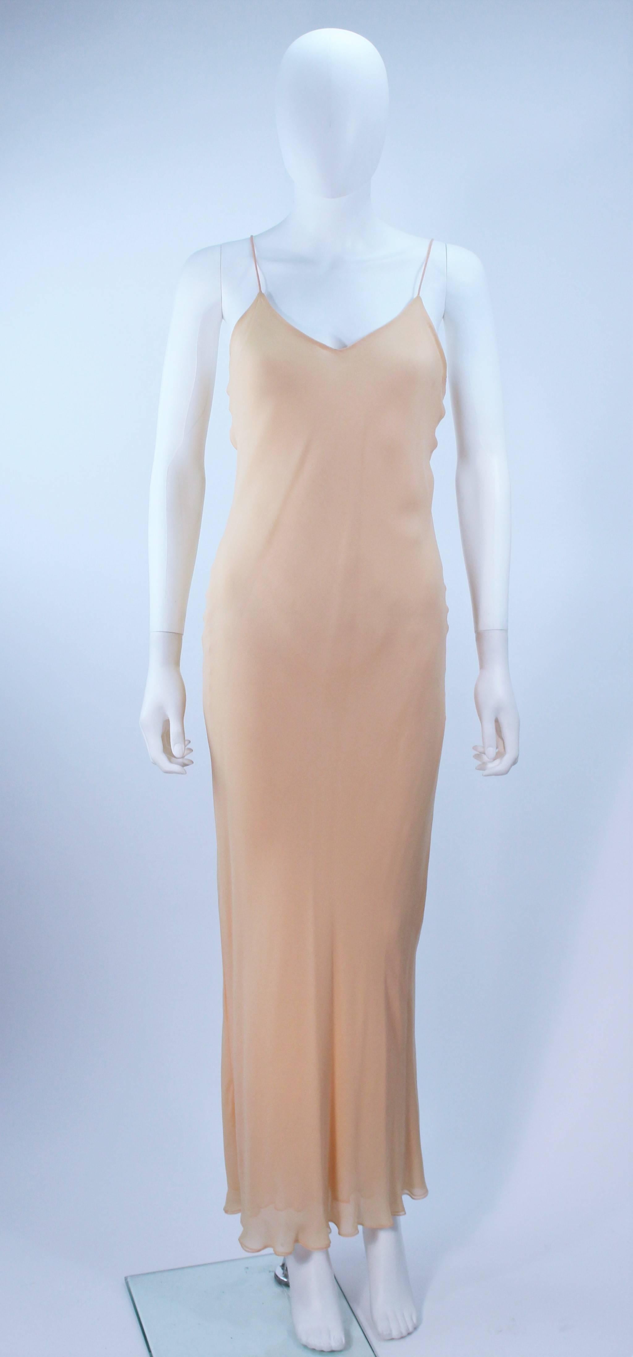  This dress is composed of a nude bias cut silk chiffon. Pull on style. In excellent vintage condition.

  **Please cross-reference measurements for personal accuracy. Size in description box is an estimation.

Measures (Approximately)
Length: