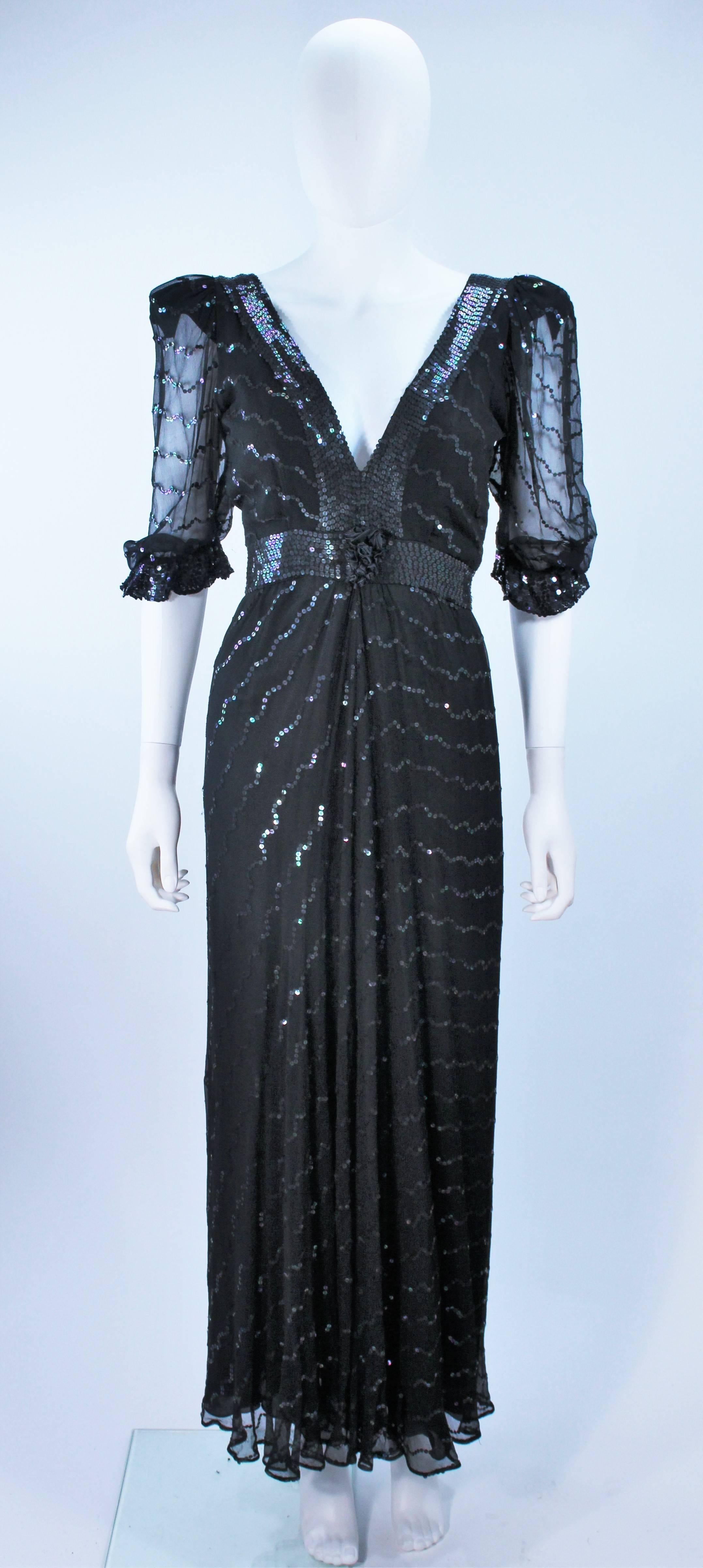  This gown is composed of a black silk chiffon with iridescent sequin applique.. The empire waist is accented by a billow sleeve and center front floral accent. In excellent vintage condition.

  **Please cross-reference measurements for personal