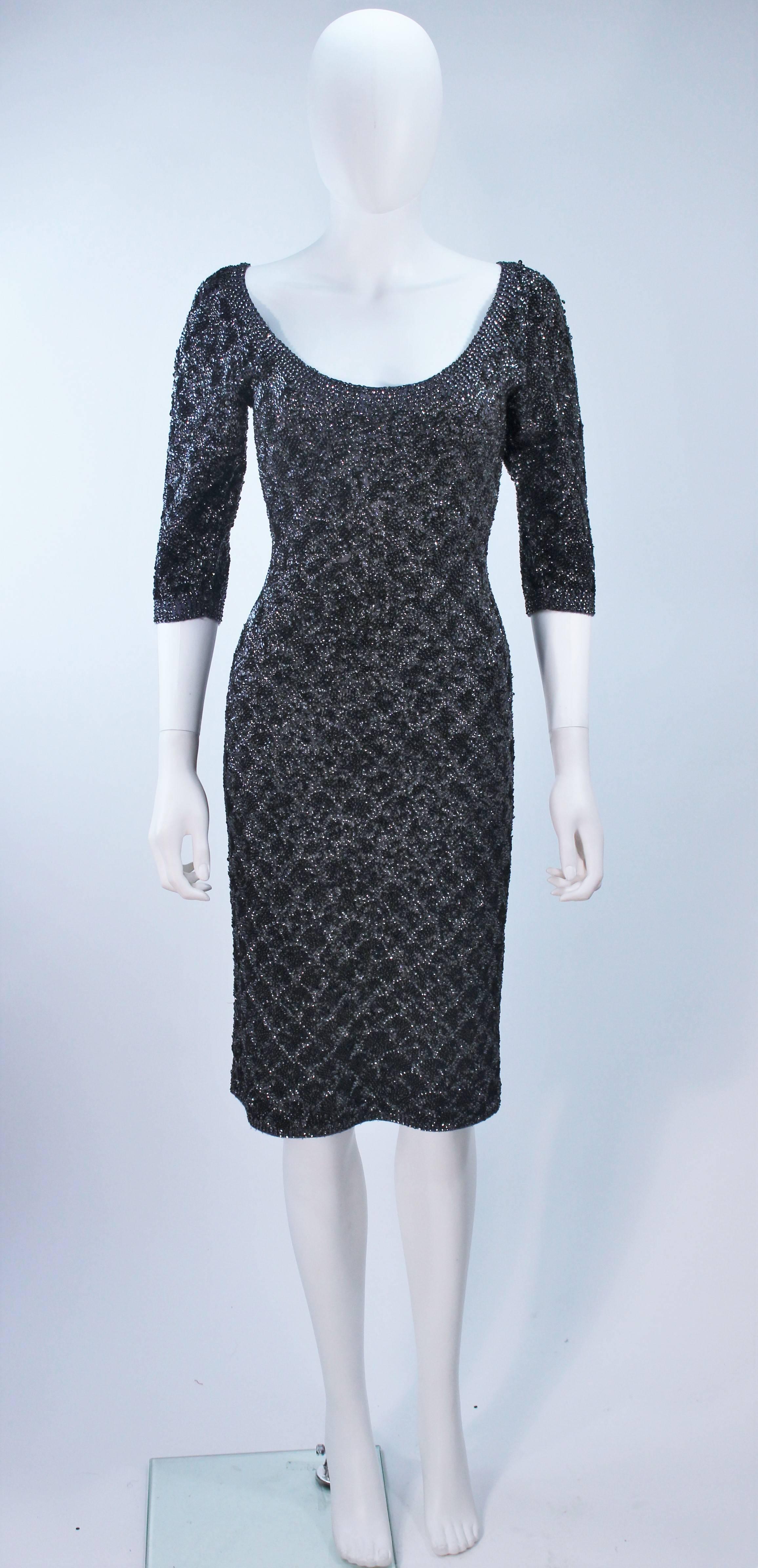 This Sydney's cocktail dress is composed of a stretch grey knit wool with a black & gunmetal metallic sequin applique. There is a center back zipper closure. In excellent vintage condition. 

**Please cross-reference measurements for personal