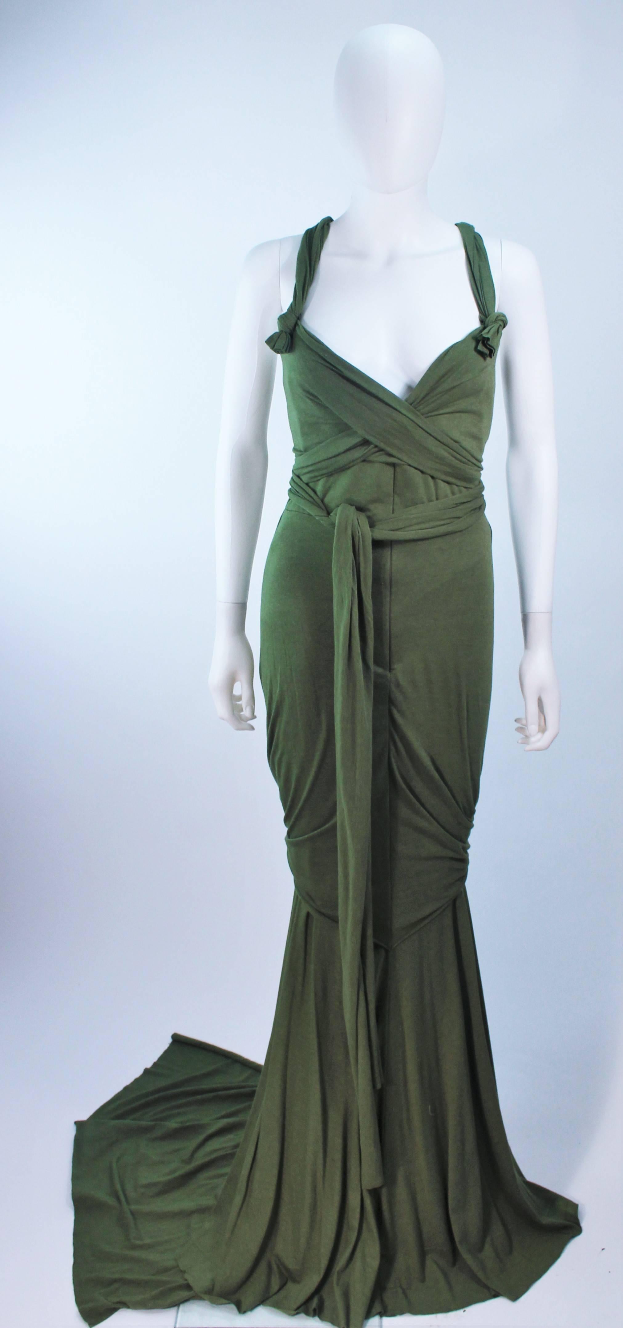 This Elizabeth Mason Couture gown is composed of bamboo jersey. Features a wrap style with a drop neckline. may be fashioned in a variety of colors.

The gown may be fashioned in a variety of colors.

This is a couture custom order. Please allow for