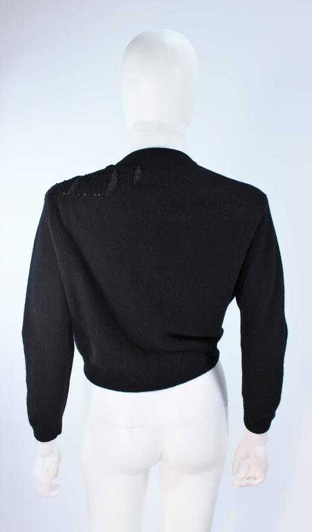 SCHIAPARELLI Black Wool Starburst Beaded Sweater Size Medium at 1stDibs
