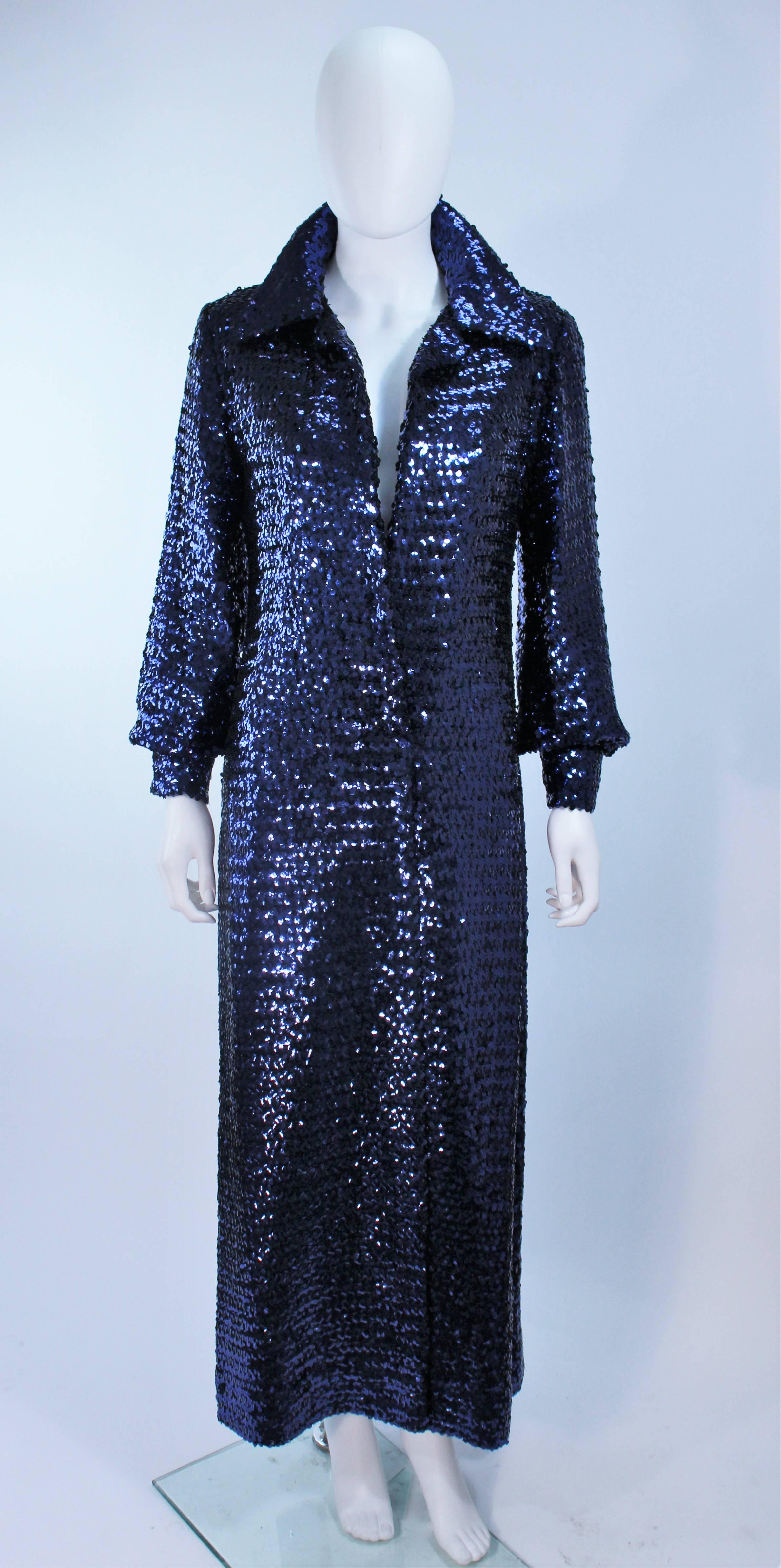 This vintage Jill Richards  coat is composed of blue sequins with a floor length style. Features two center front snap closures with snap closures at the sleeves as well. Sleeves have a slight billow style. In great vintage condition, the lining has