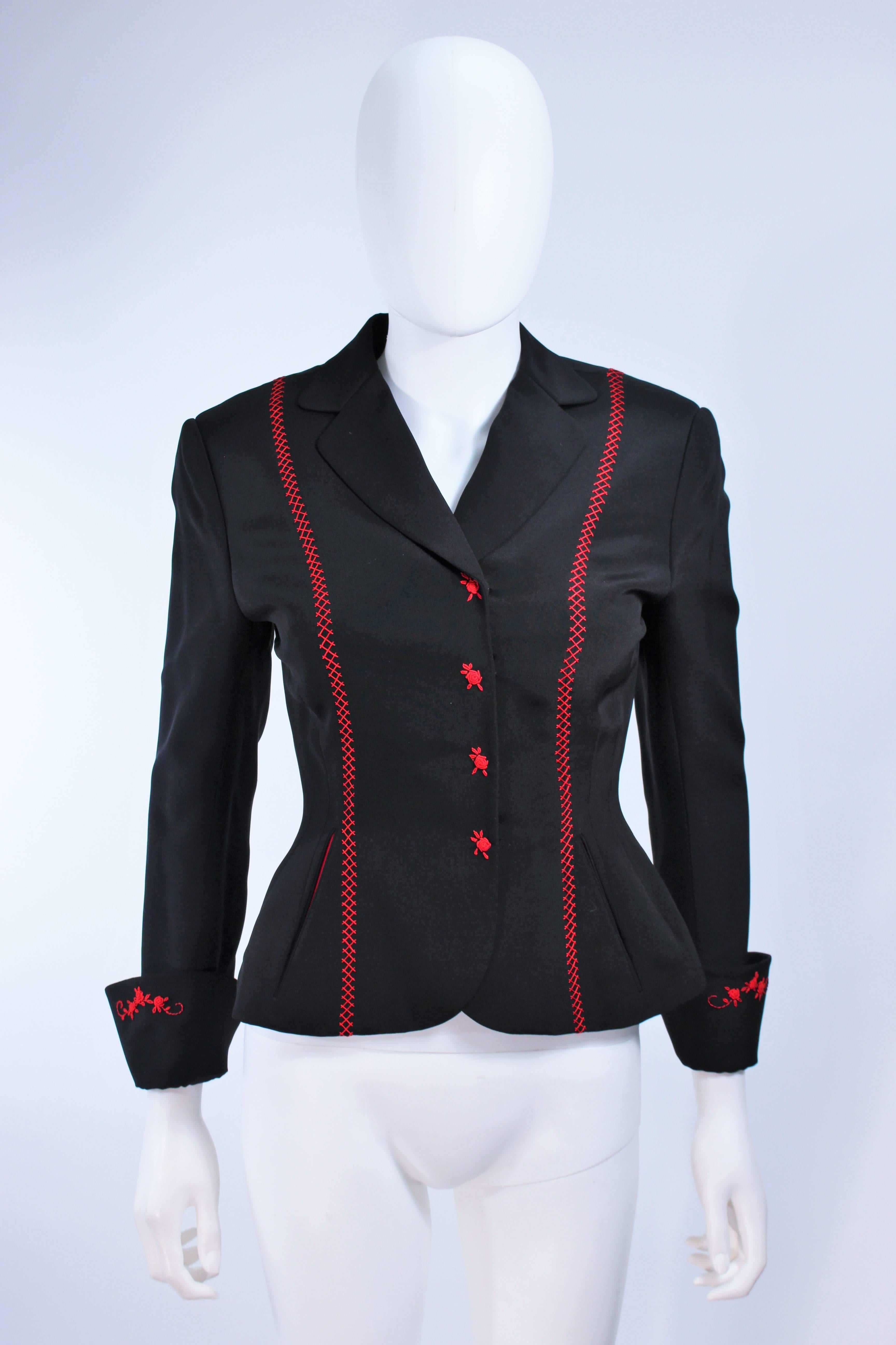 This jacket is composed of a black fabric with red top-stitch. Features center front snap closures with red rose embroidered design. In excellent vintage condition.

**Please cross-reference measurements for personal accuracy. Size in description