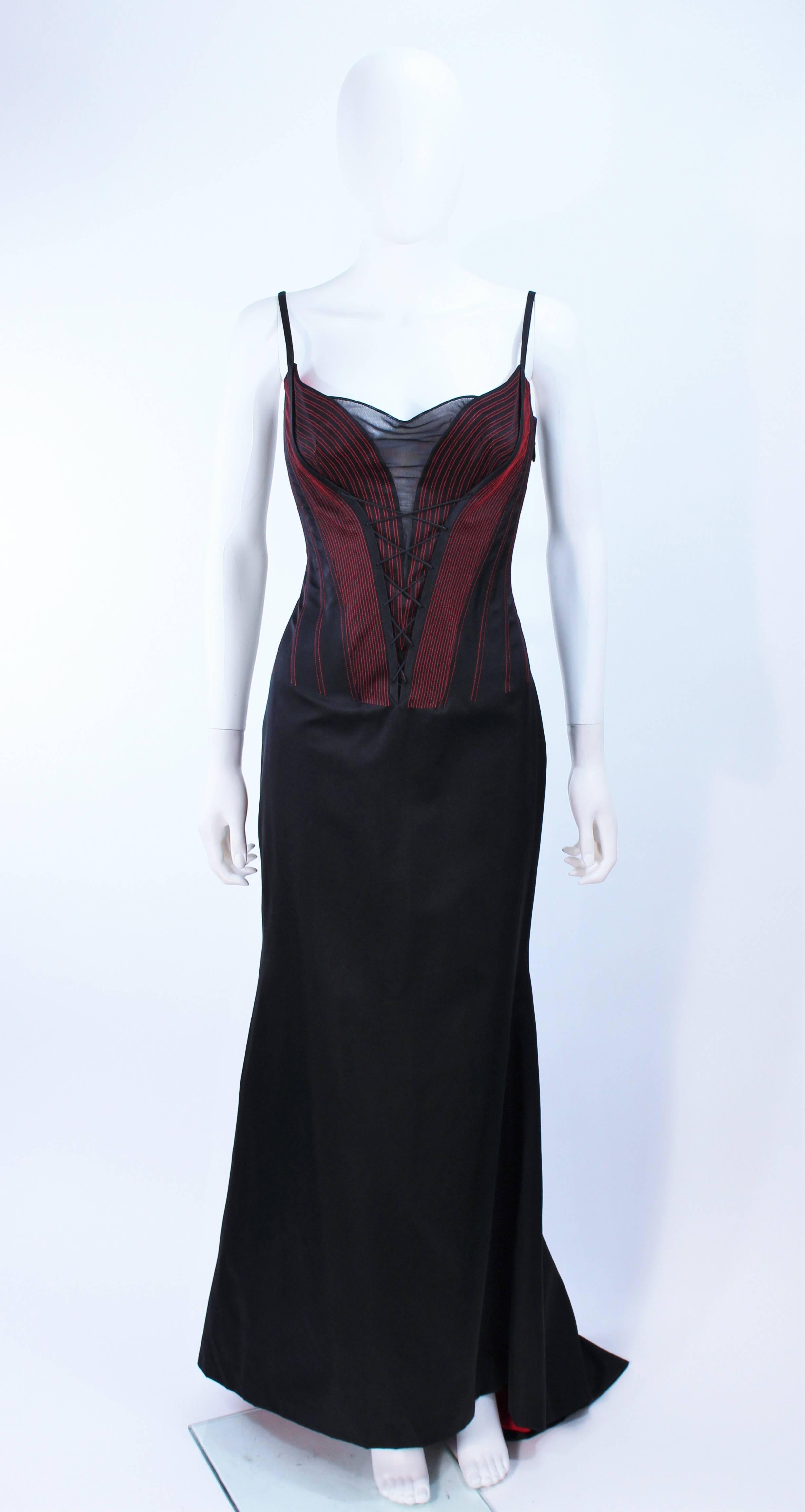 This Richard Tyler gown is composed of a black silk and features a vibrant red lining. There are top-stitch details as well as a corset style design. Side zipper closure. In excellent vintage condition.

**Please cross-reference measurements for