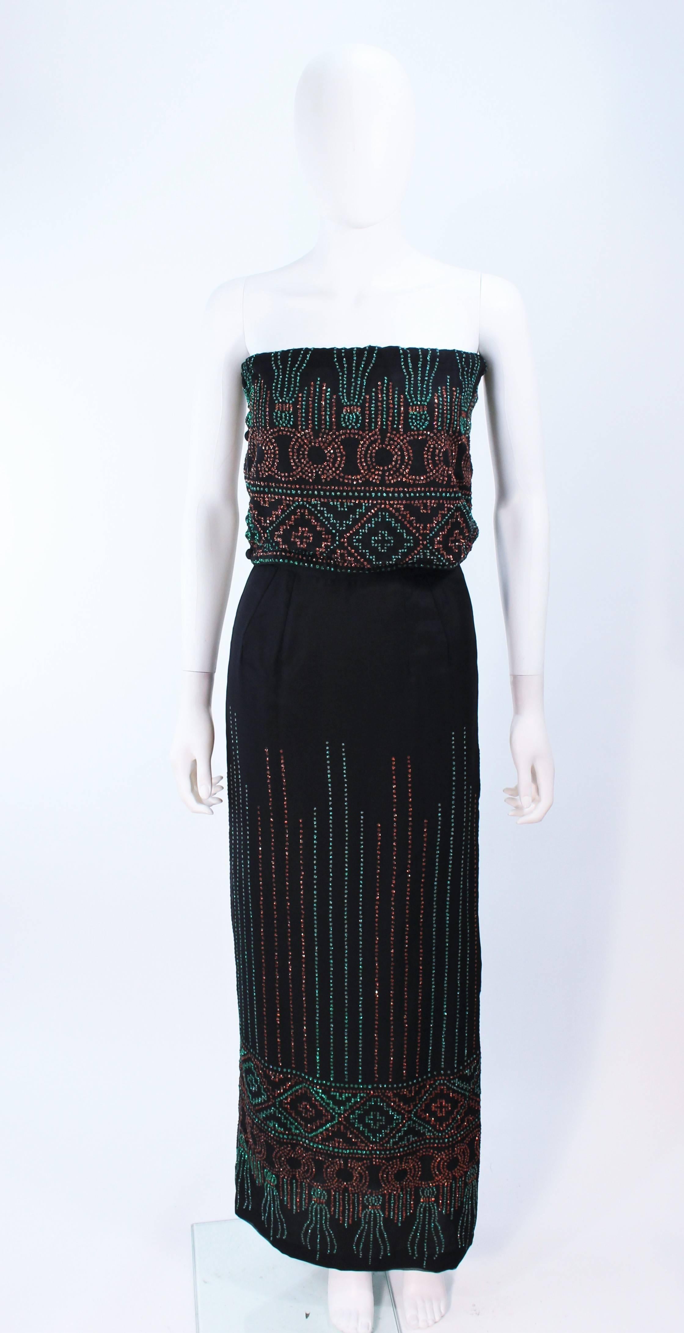 This ensemble is composed of black silk with sequin applique. Features pants, skirt, and tube top with elastic & button closures. Pants and skirt have zipper closures. In excellent vintage condition.

**Please cross-reference measurements for