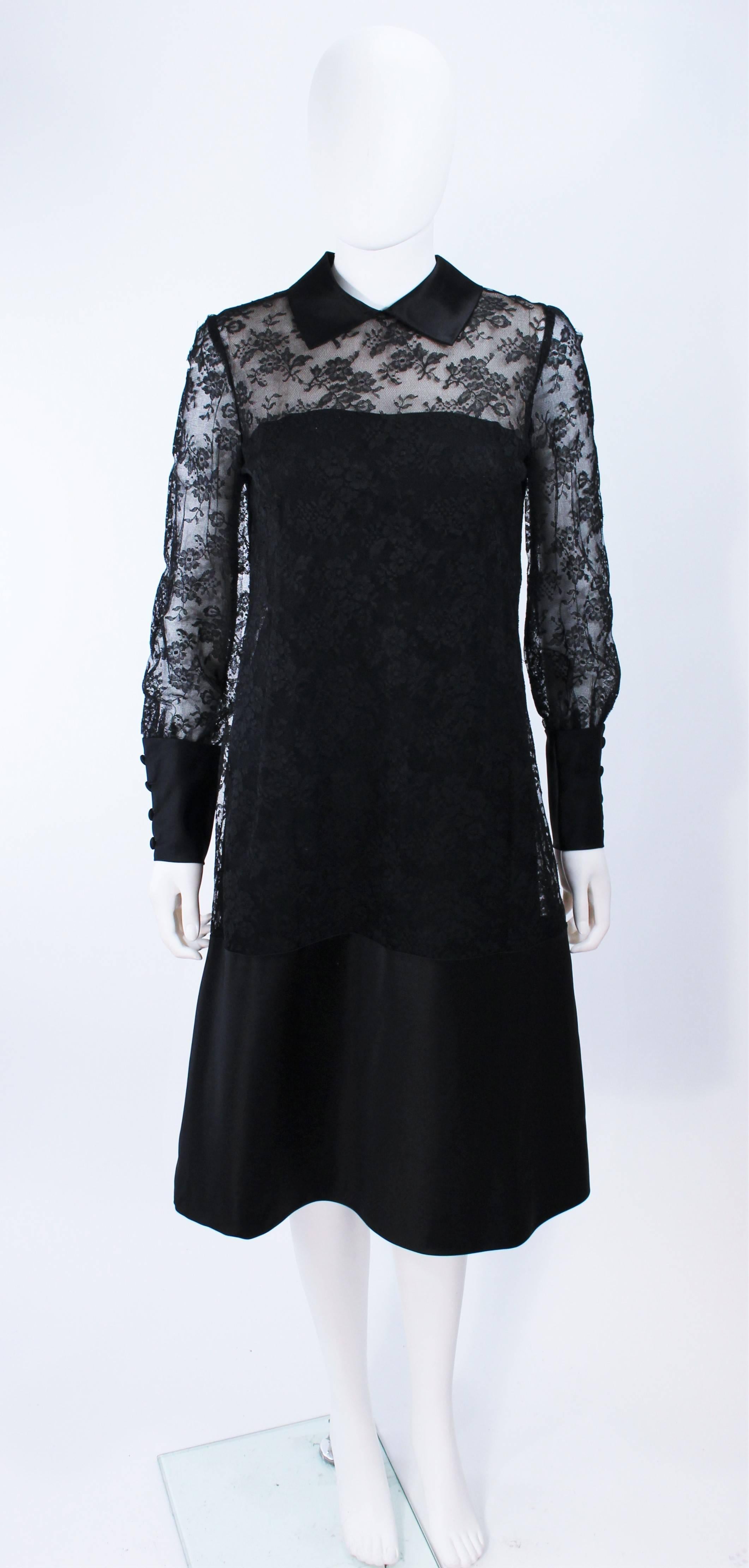 This Malcolm Starr design is composed of a black lace with silk accenting. Features a center back zipper closure with buttons. In excellent vintage condition.

**Please cross-reference measurements for personal accuracy. Size in description box is