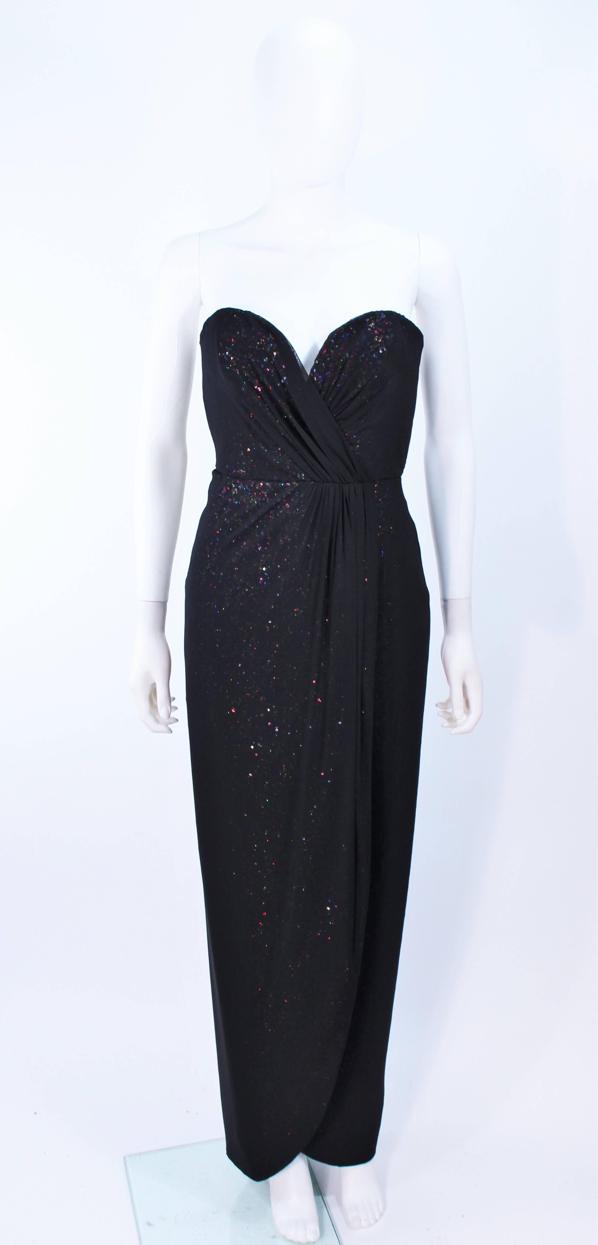 This Vicky Tiel Gown is composed of a black mesh overlaying a rainbow iridescent sequin interior. There is a center back zipper closure with hook and eye. Boned interior. In excellent condition, with original tags and unworn.

**Please