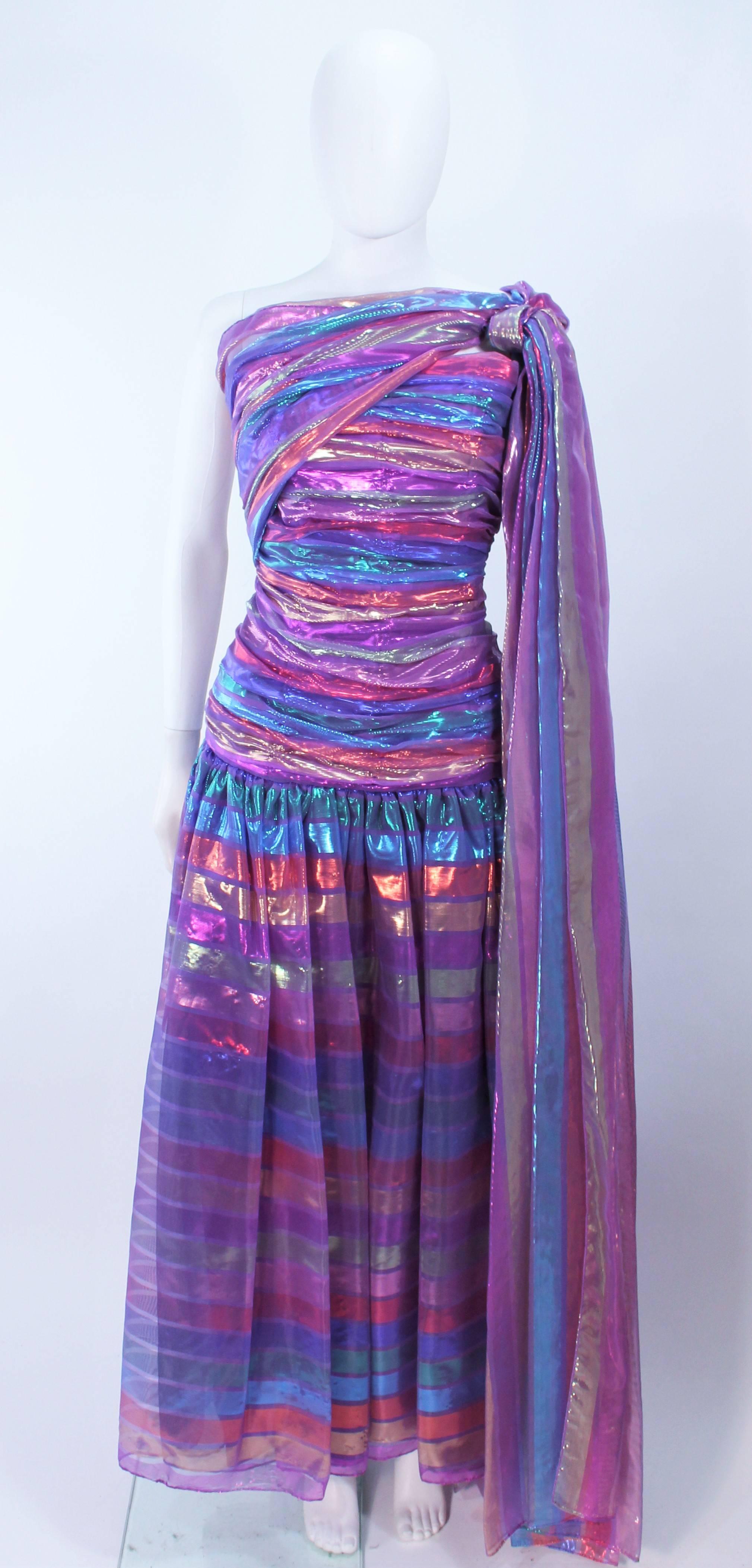 This Victor Costa gown is composed of a iridescent rainbow lame. Features a shoulder drape and ruching. There is a center back zipper closure with interior boning. In excellent vintage condition.

**Please cross-reference measurements for personal