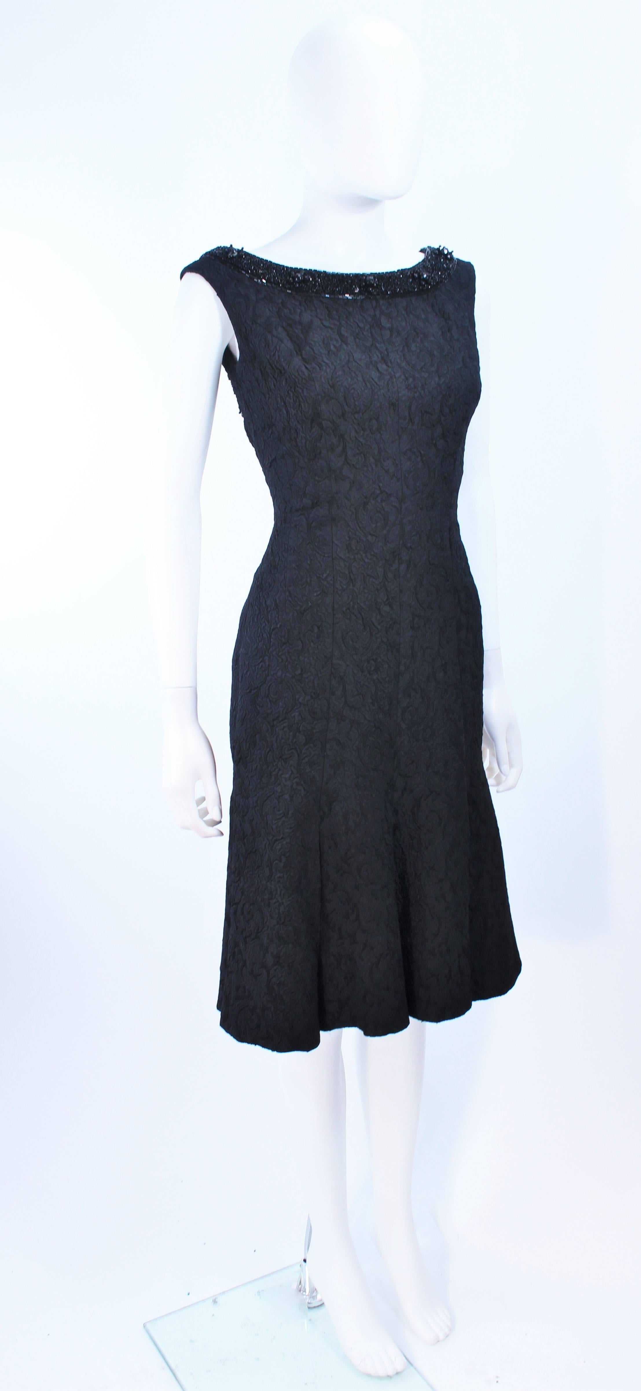 Vintage 1960's Black Brocade Cocktail Dress with Beaded Neckline Size 2 In Excellent Condition For Sale In Los Angeles, CA