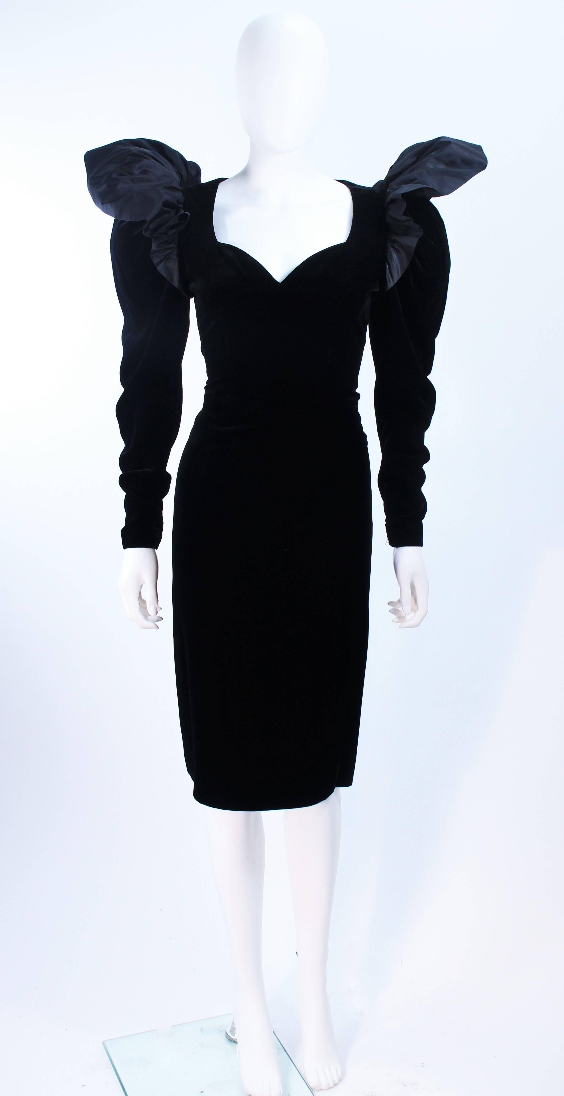This Lanvin cocktail dress is composed of a black velvet with taffeta shoulder accents. Features a sleek and classic pencil style with a center back zipper closure. In excellent vintage condition.

**Please cross-reference measurements for