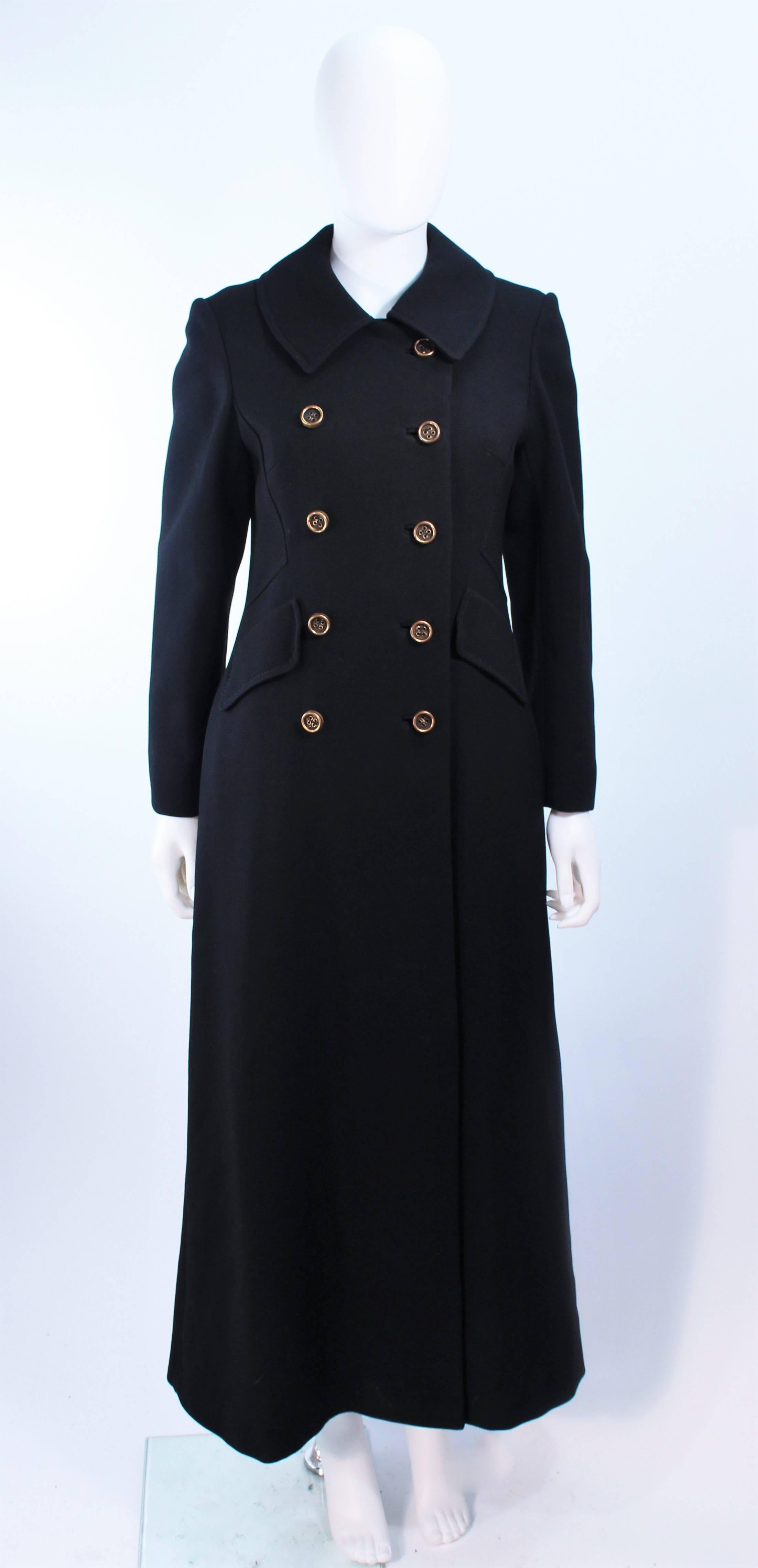 This Alton Lewis design is composed of a black wool. Features a double breasted style. In excellent vintage condition, there are a few repairable small moth holes, see photographs.

**Please cross-reference measurements for personal accuracy. Size