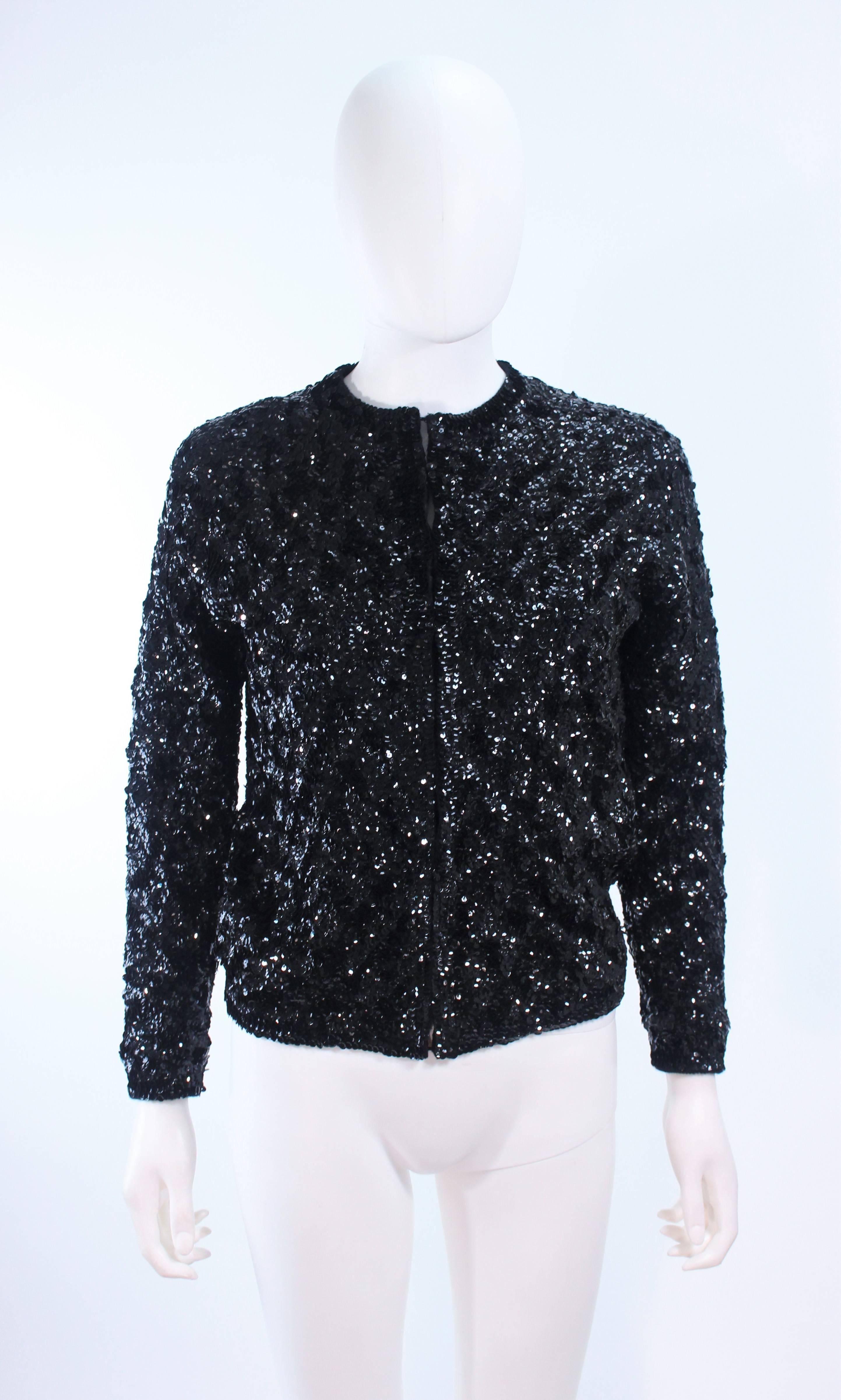 This sequin cardigan is composed of a sequin wool. There are center front hook and eye closures. In excellent vintage condition.

**Please cross-reference measurements for personal accuracy. Size in description box is an estimation.

Measures