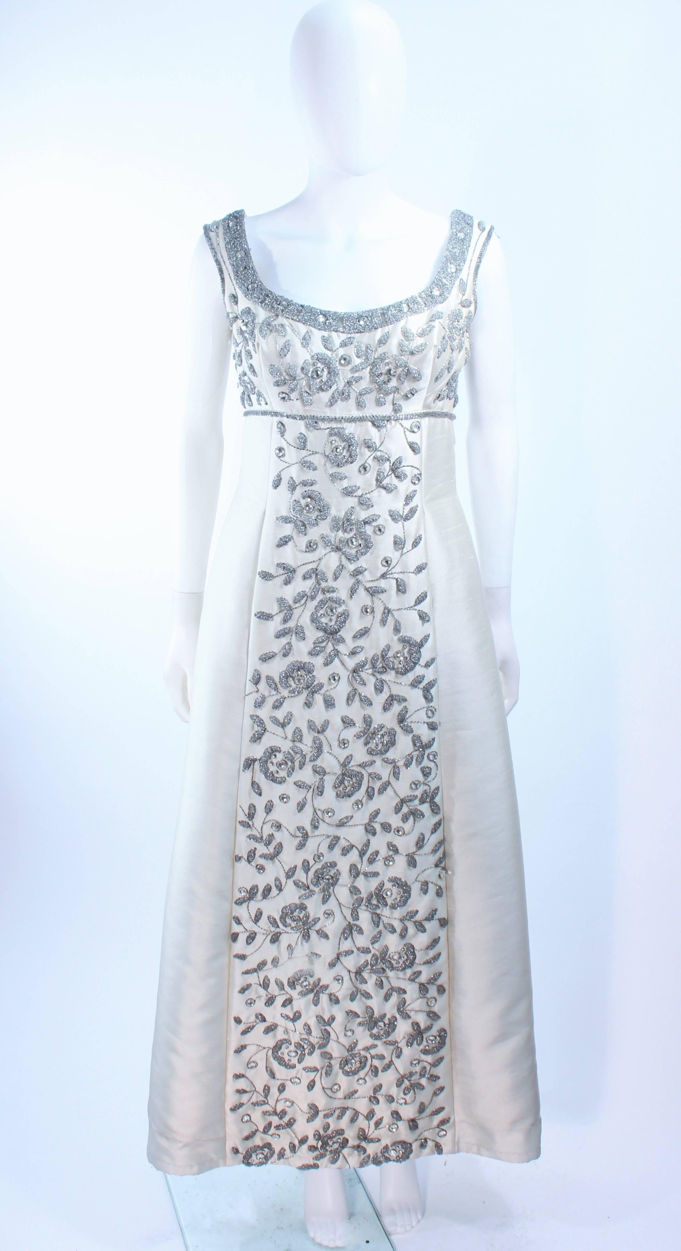 This Lillie Rubin design is composed of an off white raw silk with rhinestone embellishment in a floral patter. There is a center back zipper closure. In excellent vintage condition.

**Please cross-reference measurements for personal accuracy.