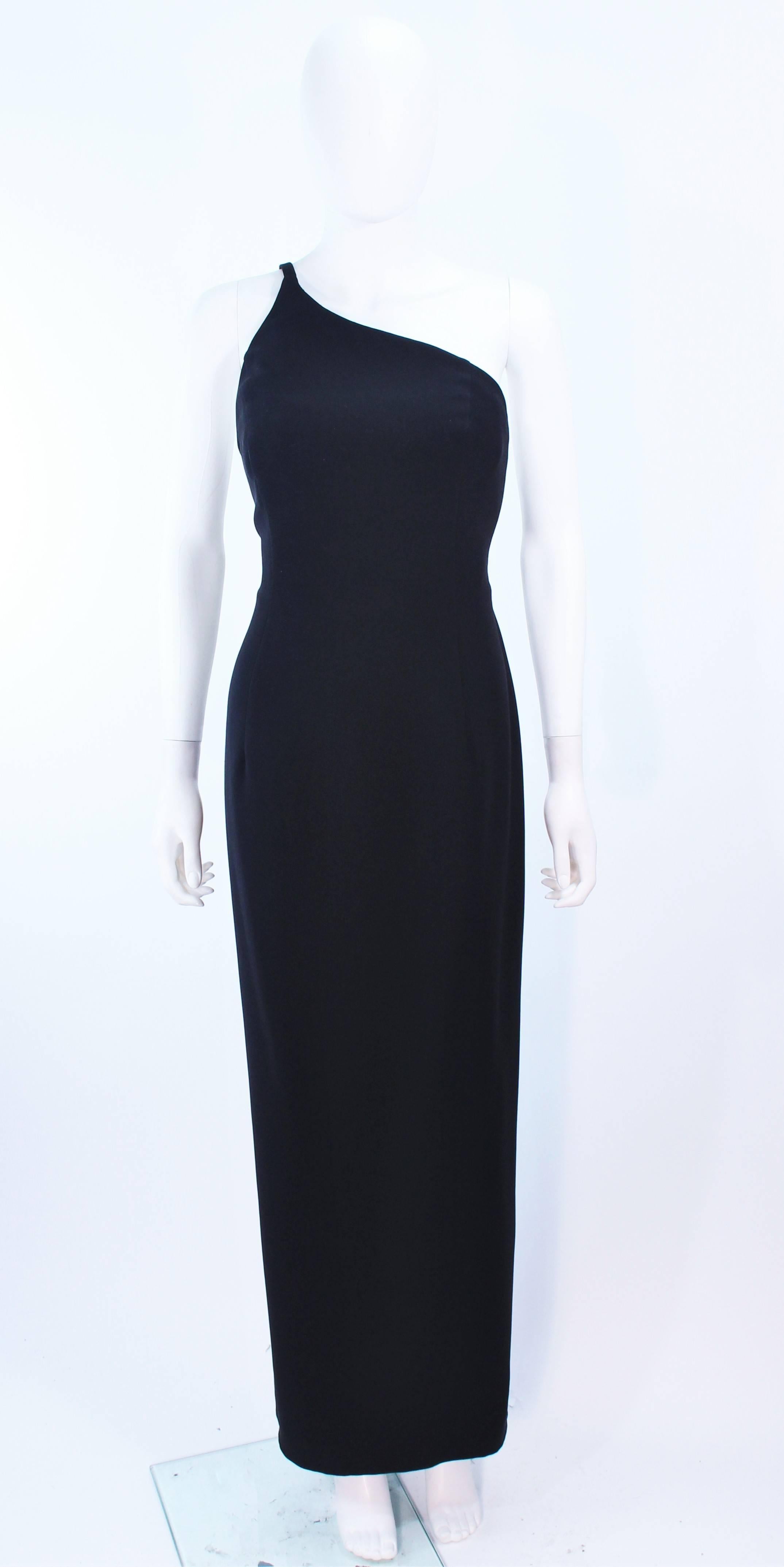 This Giorgio Armani gown is composed of a black silk crepe. Features a one shoulder style. There is a center back zipper closure, with interior boned bustier. In excellent vintage condition.

**Please cross-reference measurements for personal