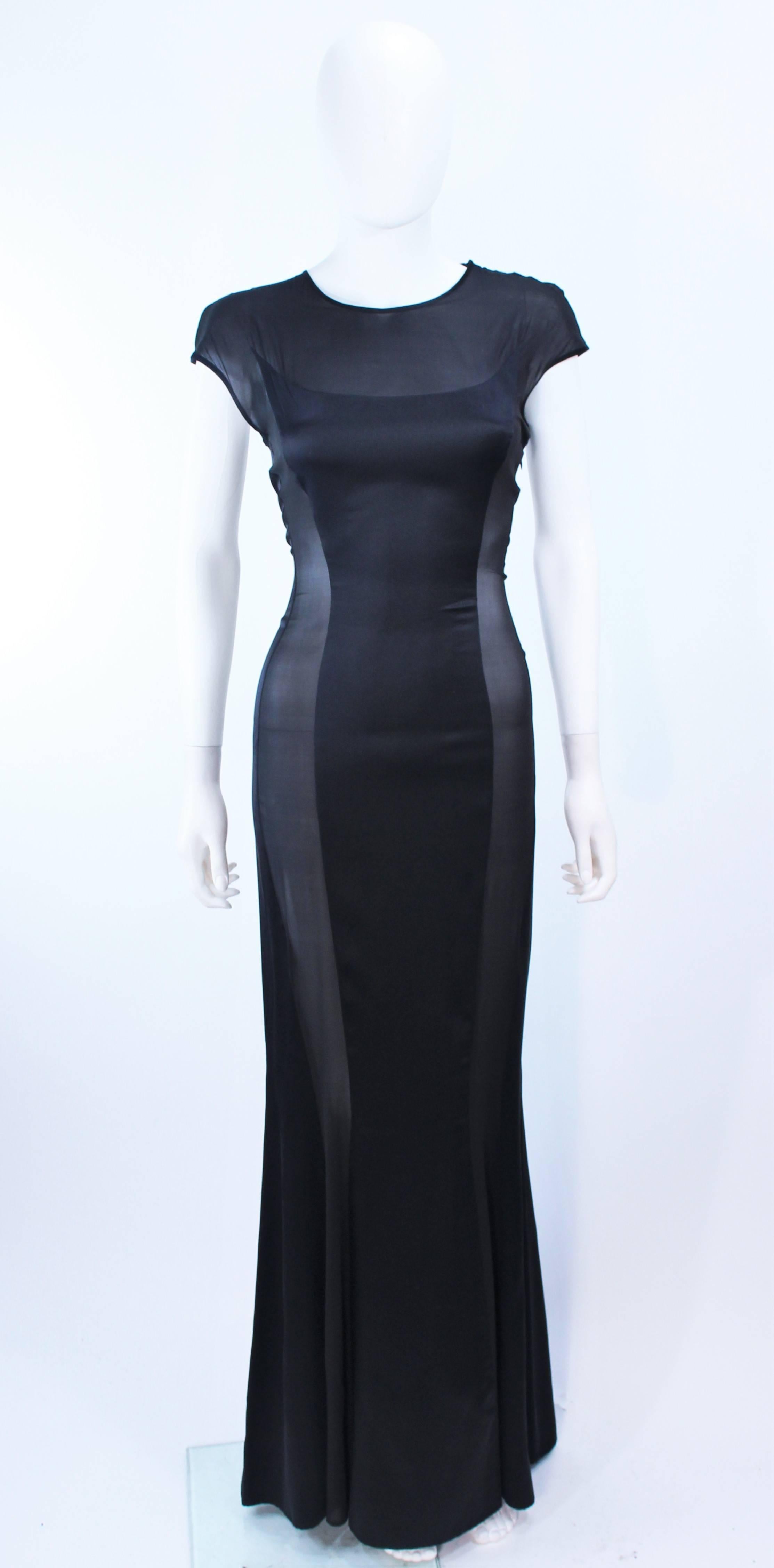 This Richard Tyler black silk chiffon gown features sheer cutout panels. There is a side zipper with snap closures at shoulder. In excellent vintage condition.

**Please cross-reference measurements for personal accuracy. Size in description box