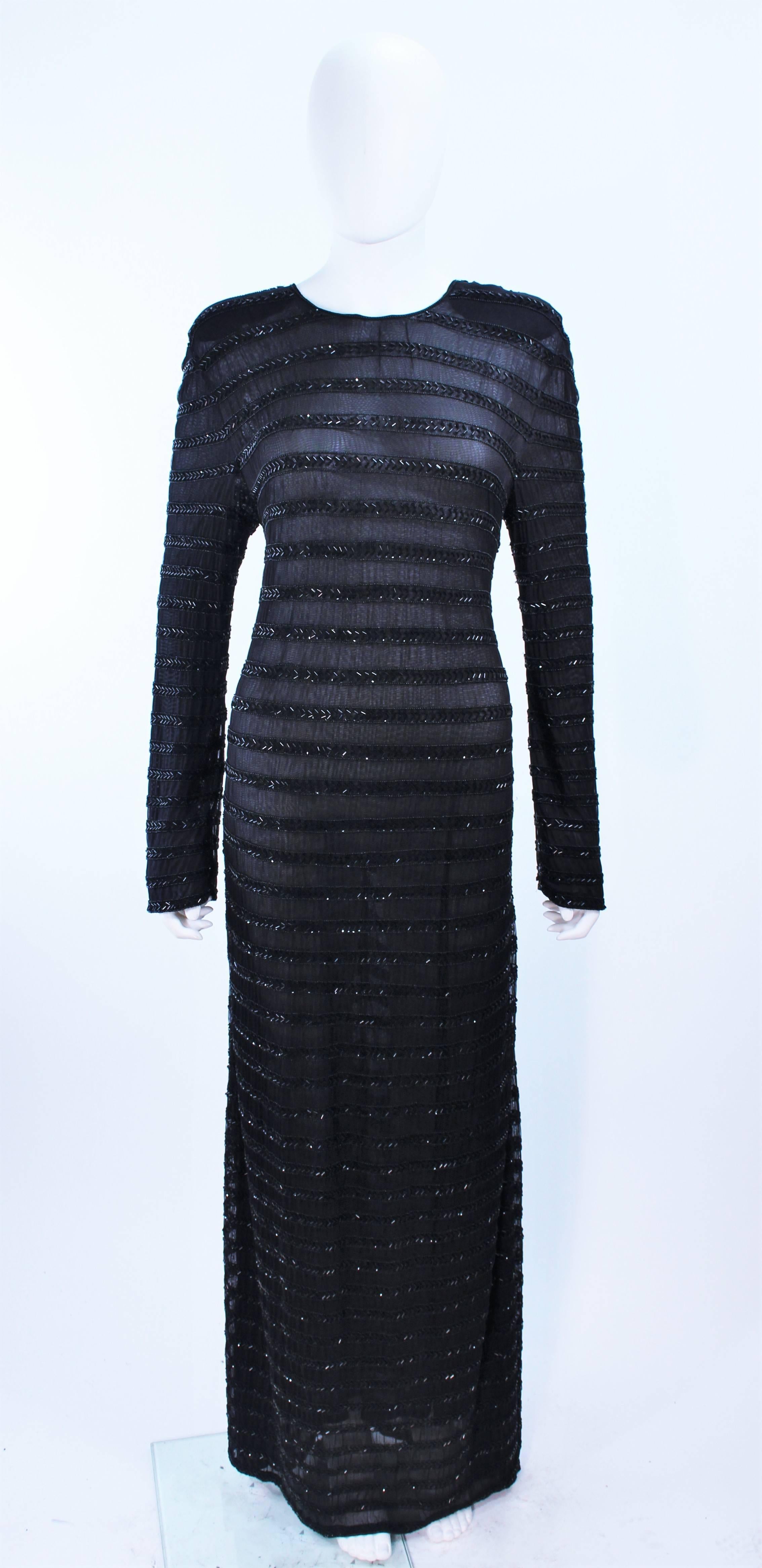 This Giorgio Armani gown is composed of a beaded sheer mesh. There is a center back zipper closure. In excellent vintage condition.

**Please cross-reference measurements for personal accuracy. 

Measures (Approximately)
Length:60