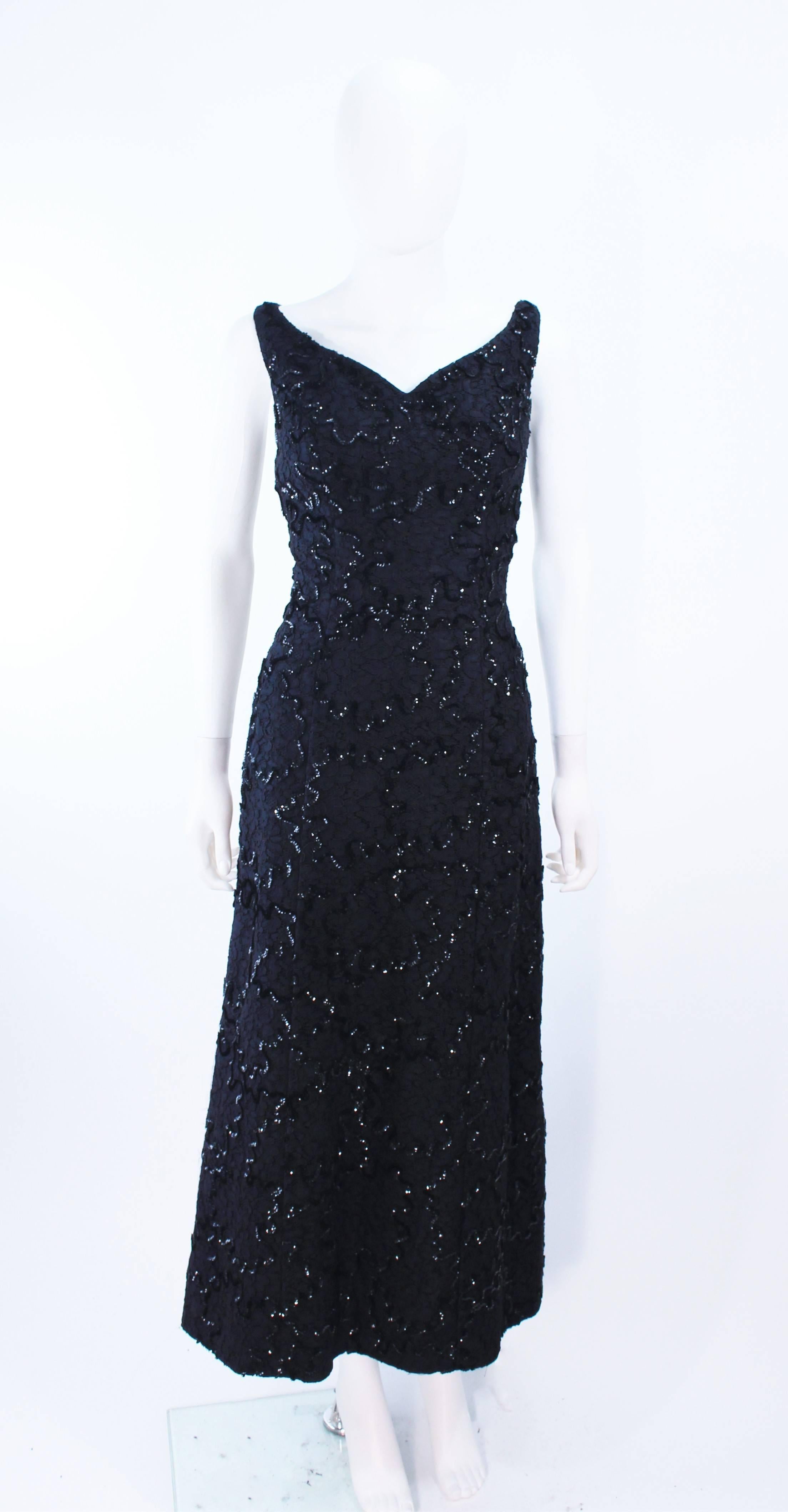 This vintage 1960's gown is composed of a black sequin lace. Features a sweetheart neckline. There is a center back zipper closure. In great vintage condition, there is some discoloration under the arms.

**Please cross-reference measurements for