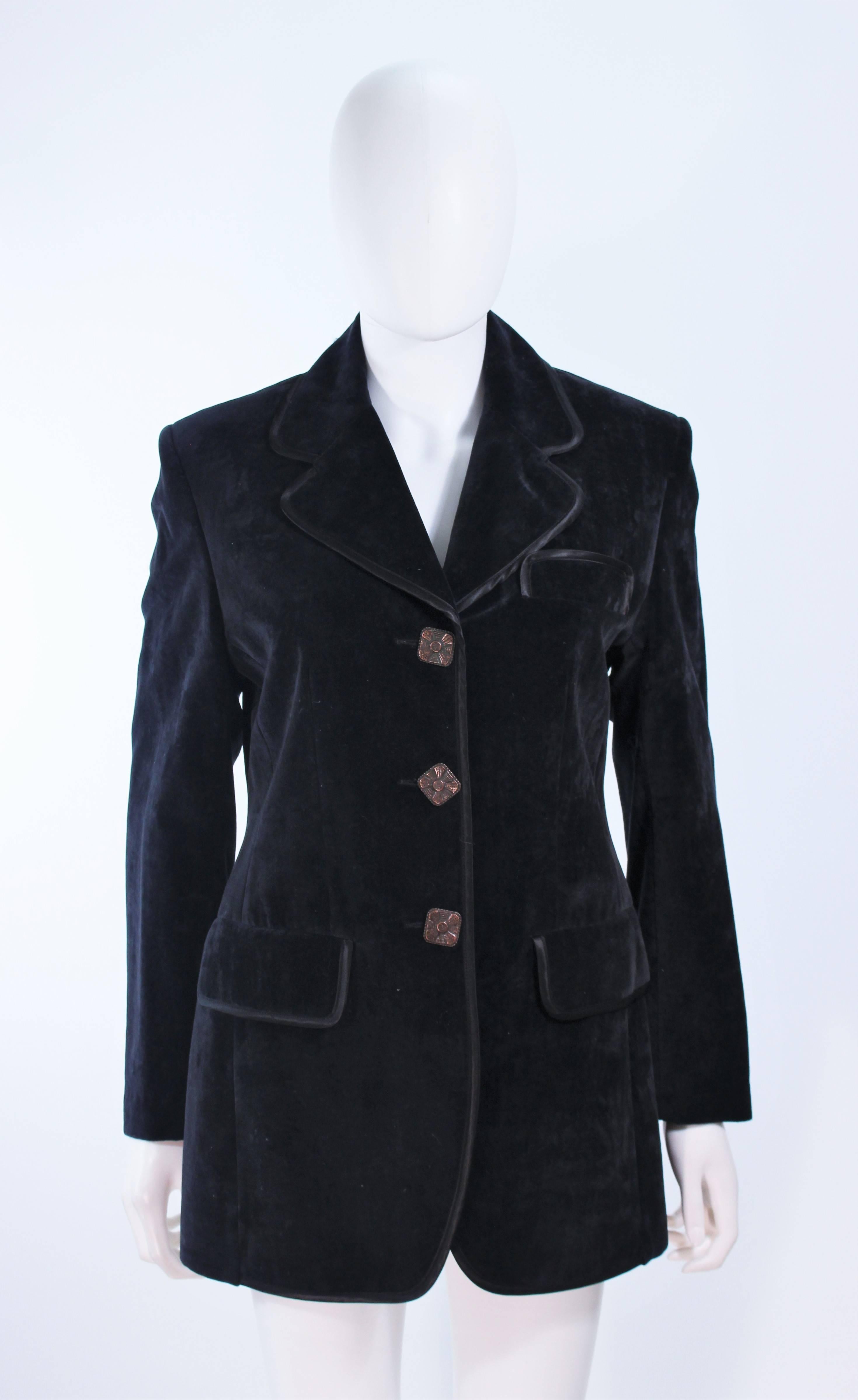 This Christian LaCroix is composed of a black velvet with a silk trim. Features center front buttons and pocket details. In excellent vintage condition.

**Please cross-reference measurements for personal accuracy. Size in description box is an