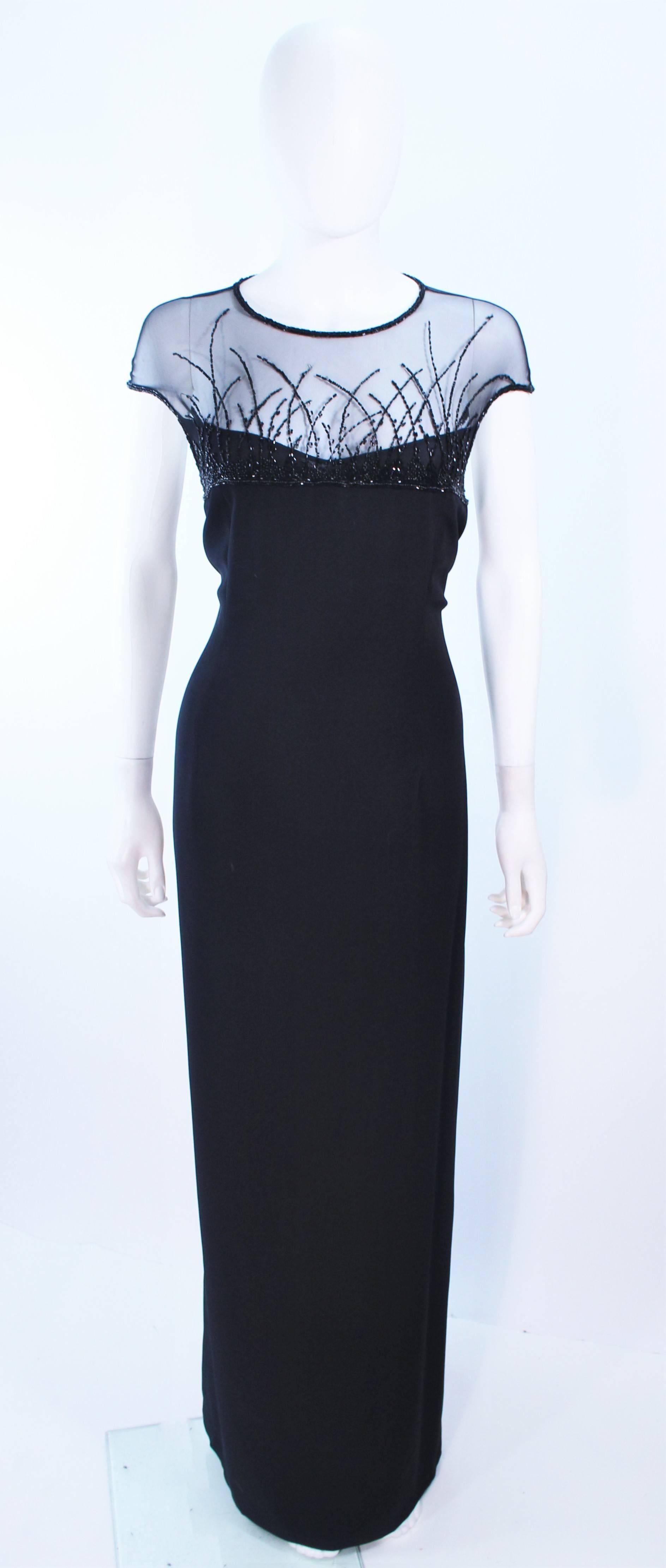 This Bob Mackie gown of a black crepe fabric with a beaded sheer mesh bodice. There is a center back zipper closure with train. In excellent vintage condition.

**Please cross-reference measurements for personal accuracy. Size in description box