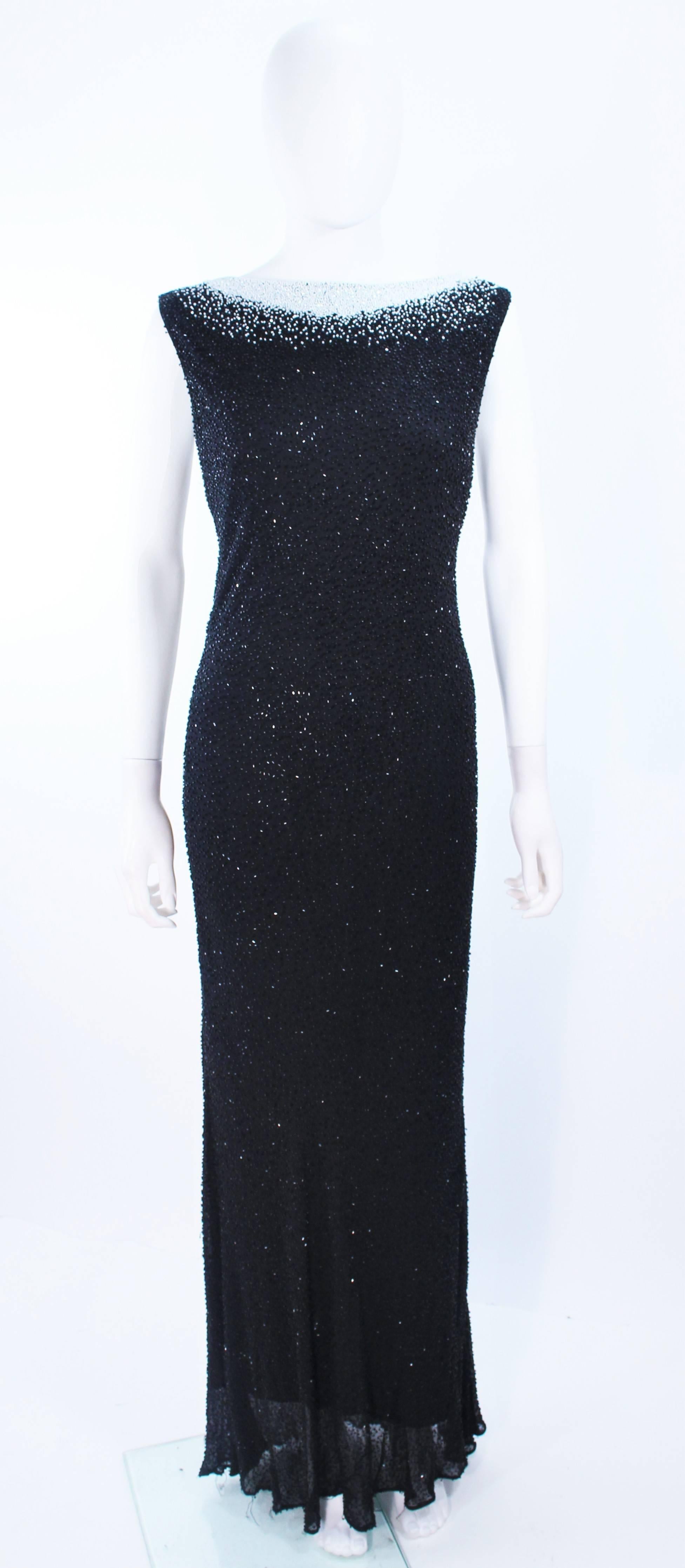 This Jovani gown is composed of a bias cut beaded fabric and features a white contrast neck. Features a v back. Pull over style. In excellent vintage condition.

**Please cross-reference measurements for personal accuracy. Size in description box