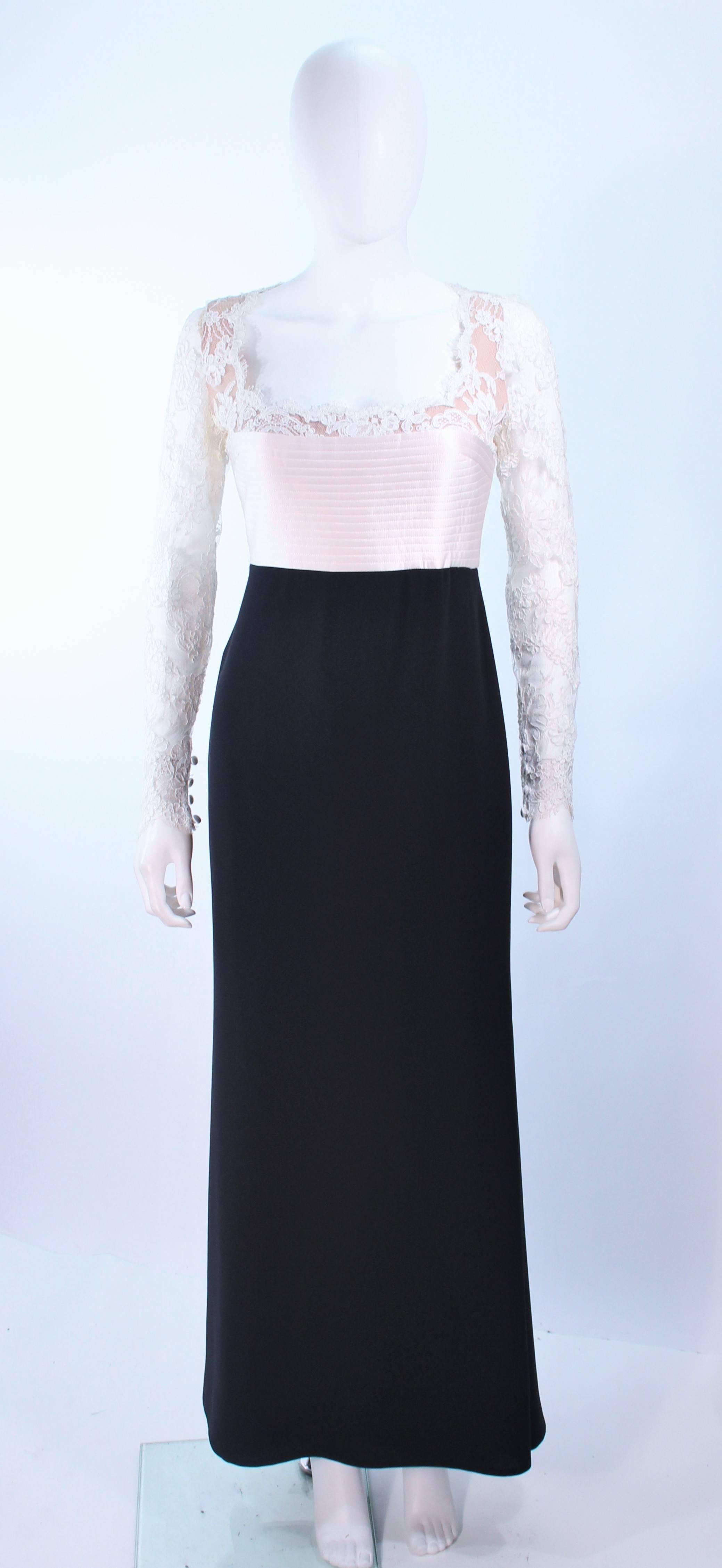 This Carolina Herrera design is composed of a white lace bodice, with top-stitched satin waist, and black skirt. There is a center back zipper with buttons. In excellent vintage condition.

**Please cross-reference measurements for personal