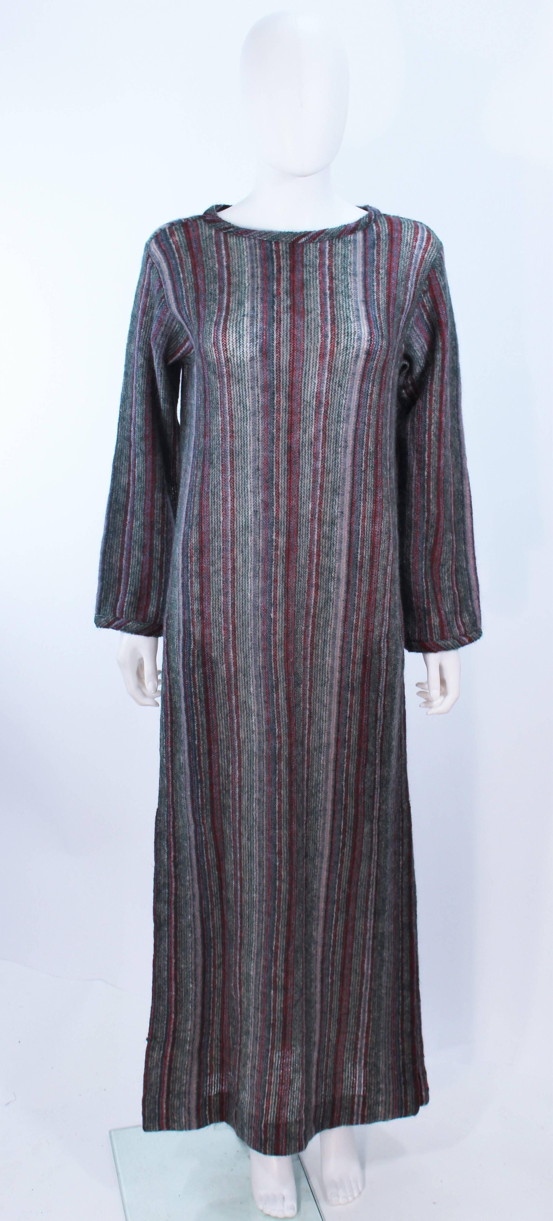 This Missoni dress is composed of a grey multi color wool knit. Features a full length style with side pockets. In excellent vintage condition.

**Please cross-reference measurements for personal accuracy. Size in description box is an