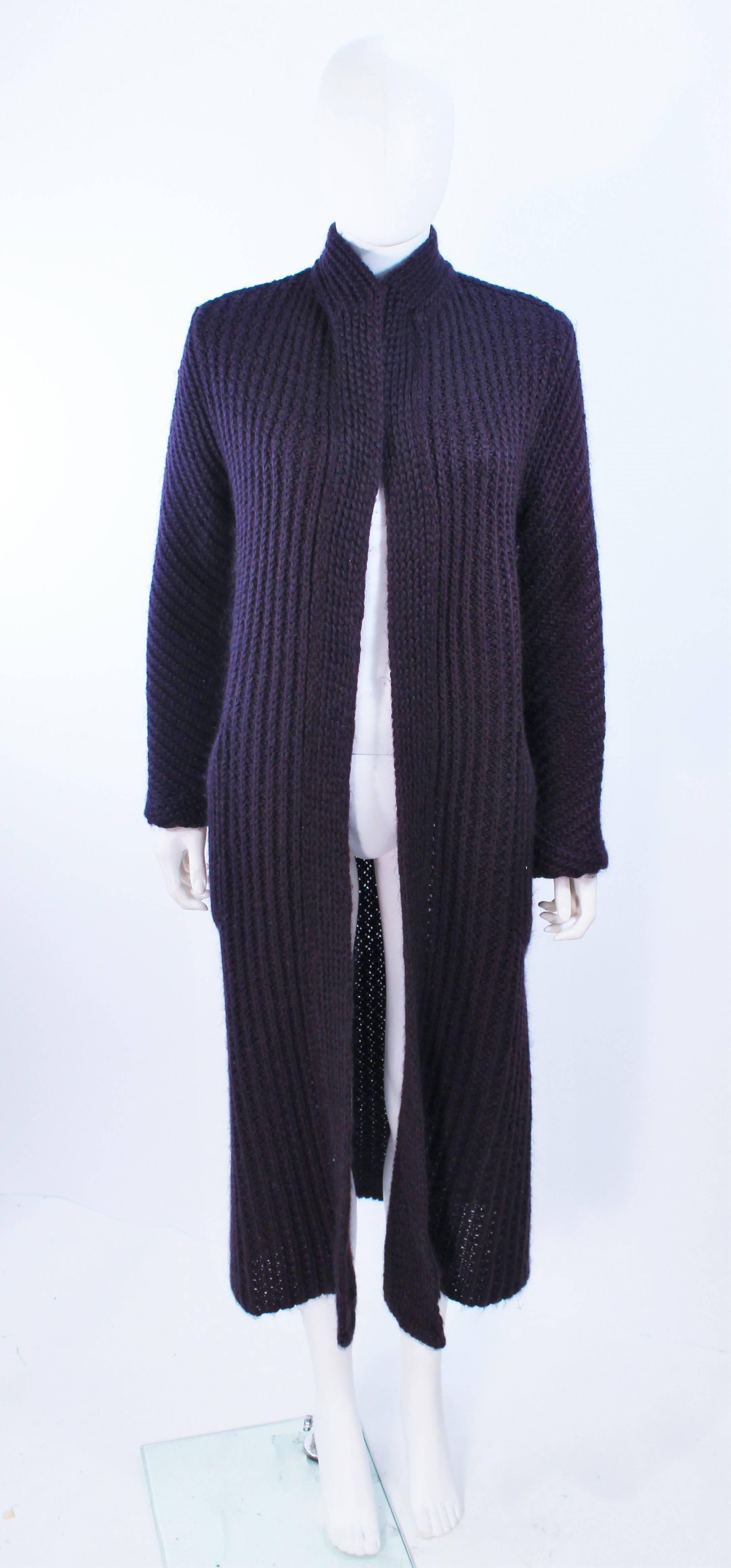 This Missoni purple wool full length sweater is composed of a purple wool. Features an open style. In excellent vintage condition.

**Please cross-reference measurements for personal accuracy. Size in description box is an estimation.

Measures