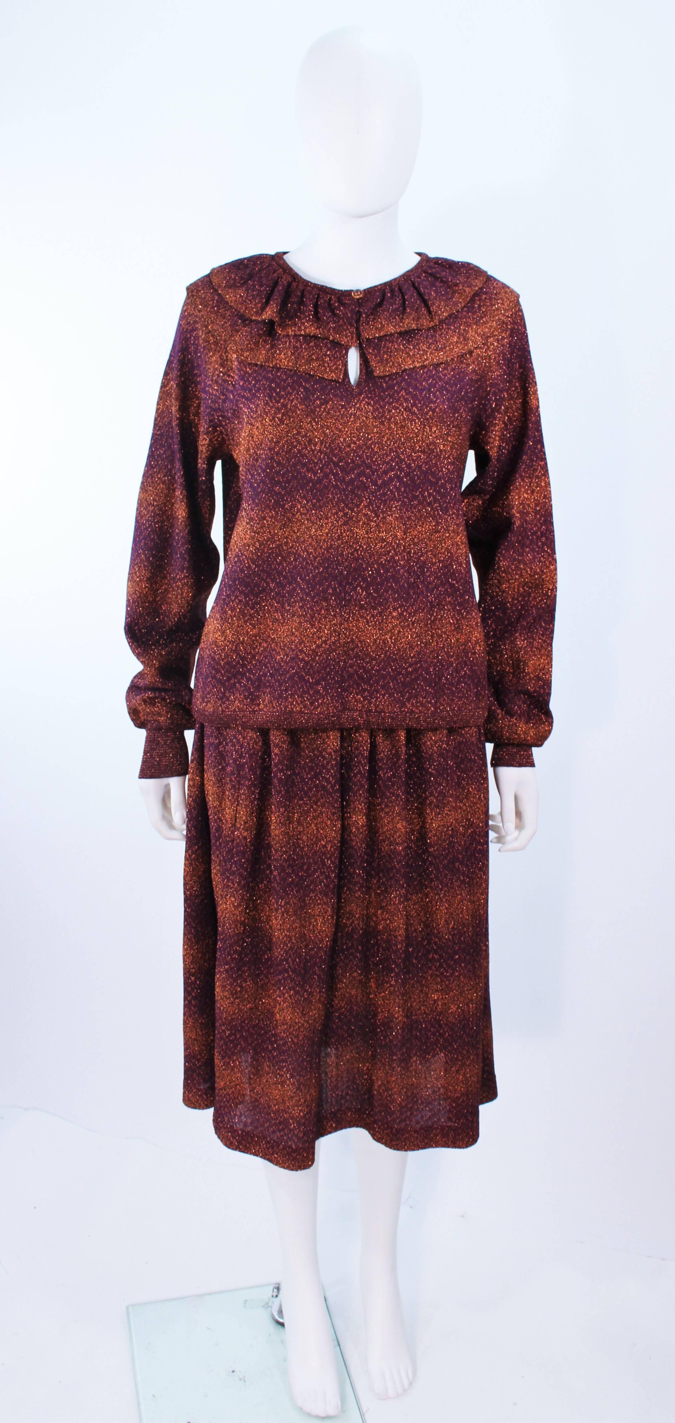 This Missoni design is composed of a a metallic knit in purple and bronze. The top features a ruffled collar with a center front button. The skirt has a classic flare design. In excellent vintage condition.

**Please cross-reference measurements