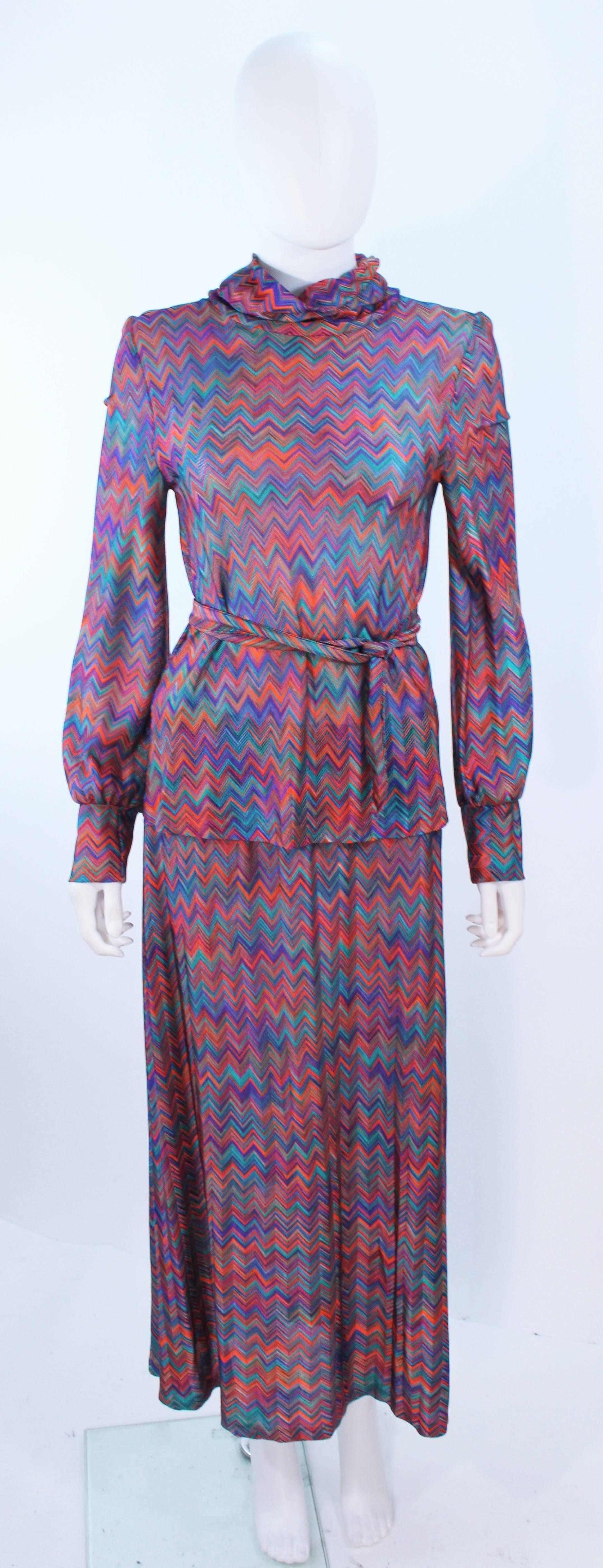 This Missoni design is composed of a purple, pink, and teal multi-color. Features a cardigan, a mock neck, sleeveless v-neck, a skirt, and two belts. In excellent vintage condition.

**Please cross-reference measurements for personal accuracy.