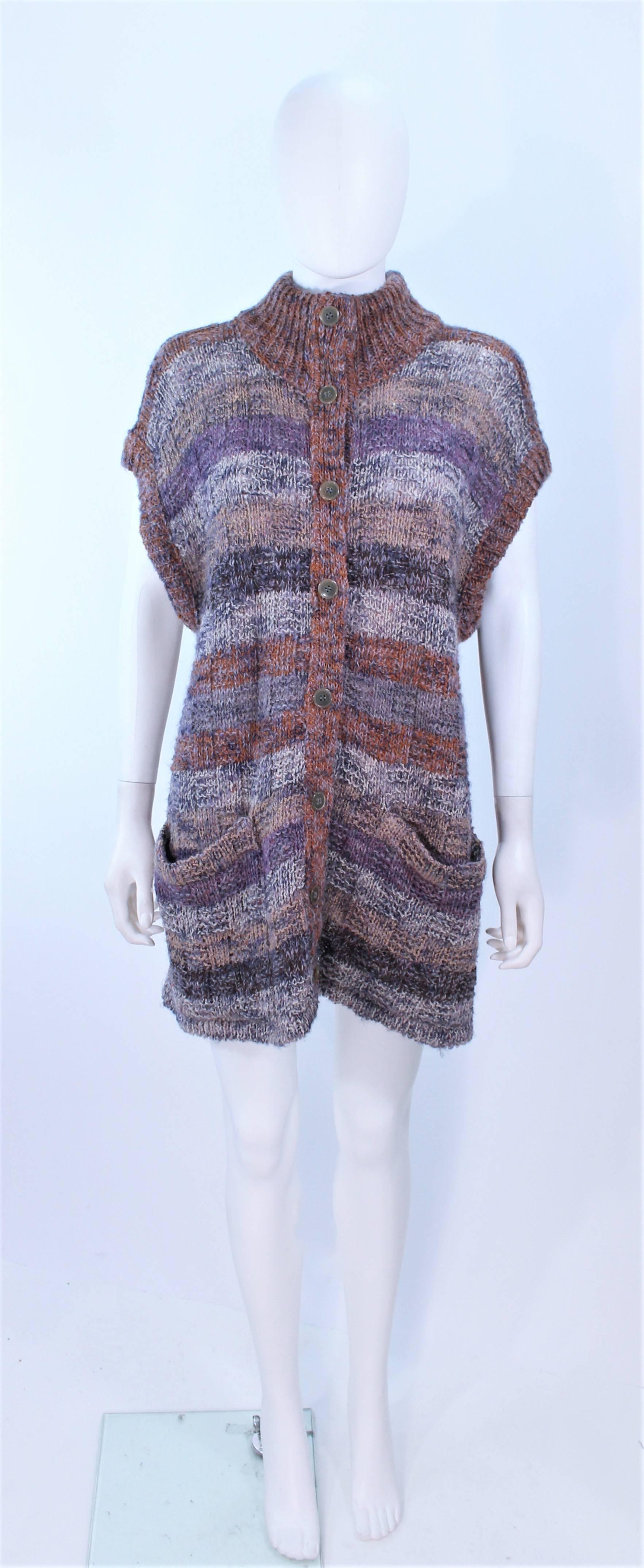 This Missoni design is composed of a mauve, lavender, and brown hue knit. Features center front buttons and pockets. In excellent vintage condition.

**Please cross-reference measurements for personal accuracy. Size in description box is an