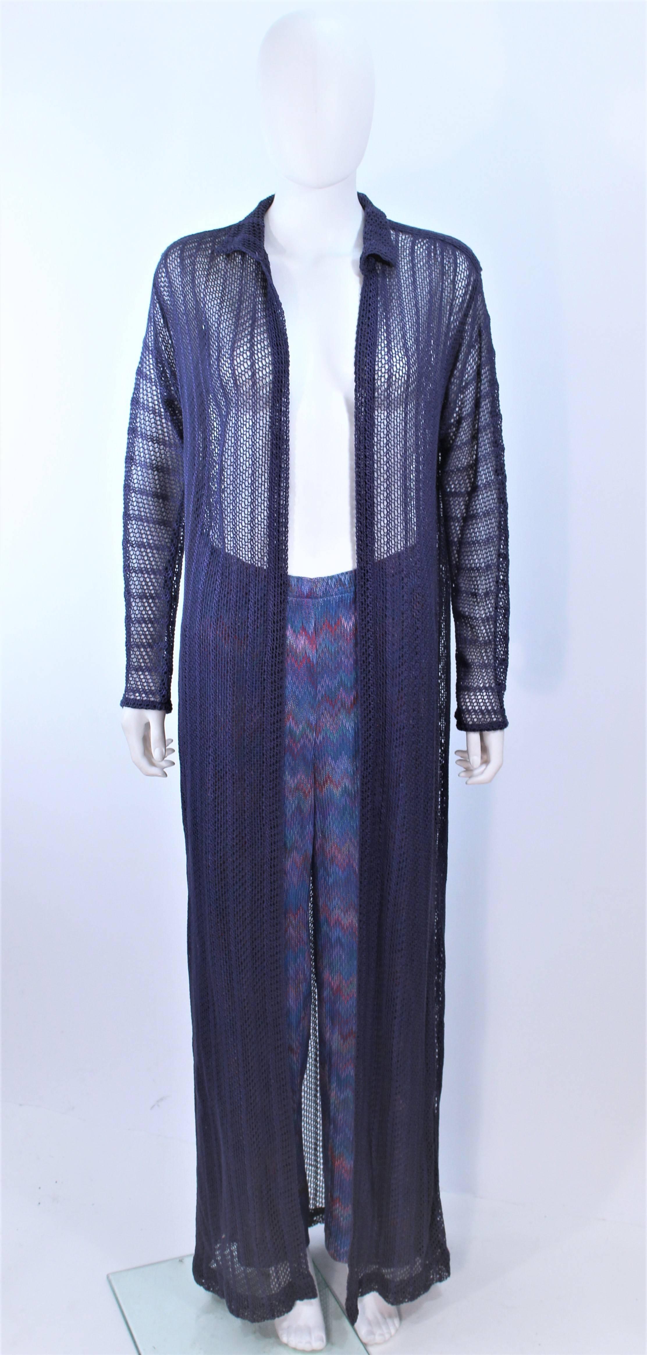 This Missoni set is composed of a periwinkle hue full length knit duster and zig zag print pants. Sweater has an open style and the pants have an elastic waist. In excellent vintage condition.

**Please cross-reference measurements for personal