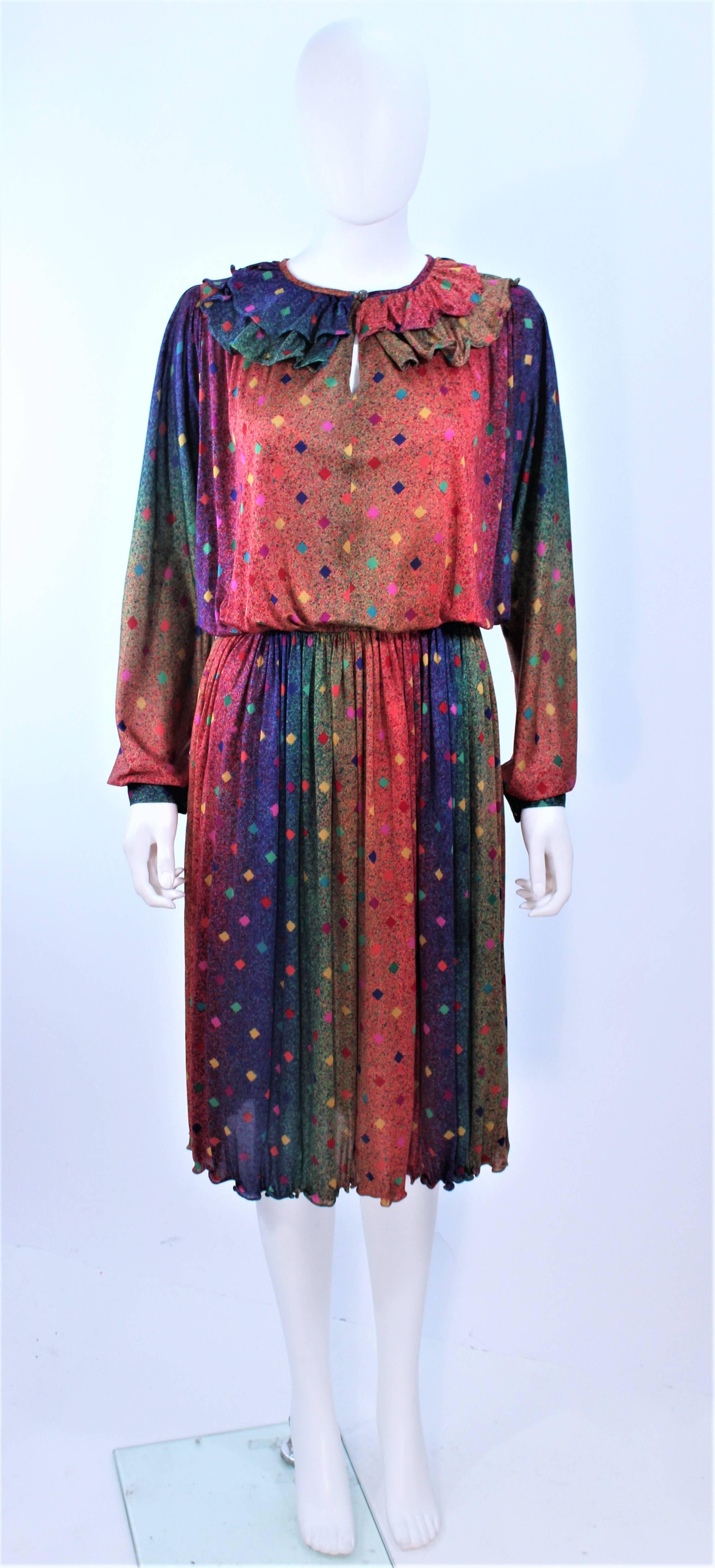This Missoni design is composed of a rainbow printed silk. Features a ruffled neck with a center front button and elastic waist detail. In excellent vintage condition.

**Please cross-reference measurements for personal accuracy. Size in