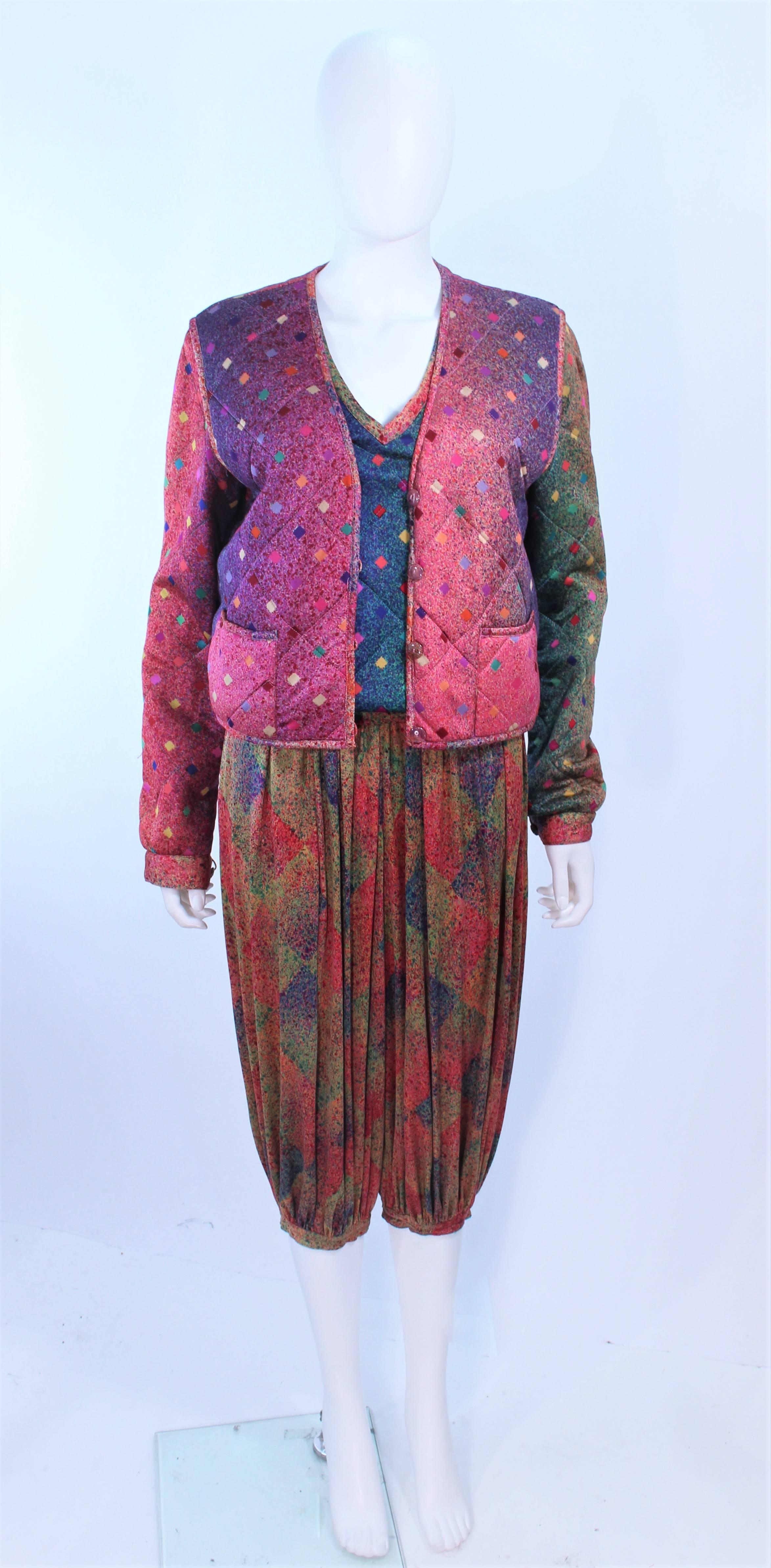 This Missoni design is composed of a rainbow print in silk, with a quilted vest and sweater. The vest is reversible with pockets, and center front button closures. The Harem style pants feature a gathered style and elastic waist. In excellent