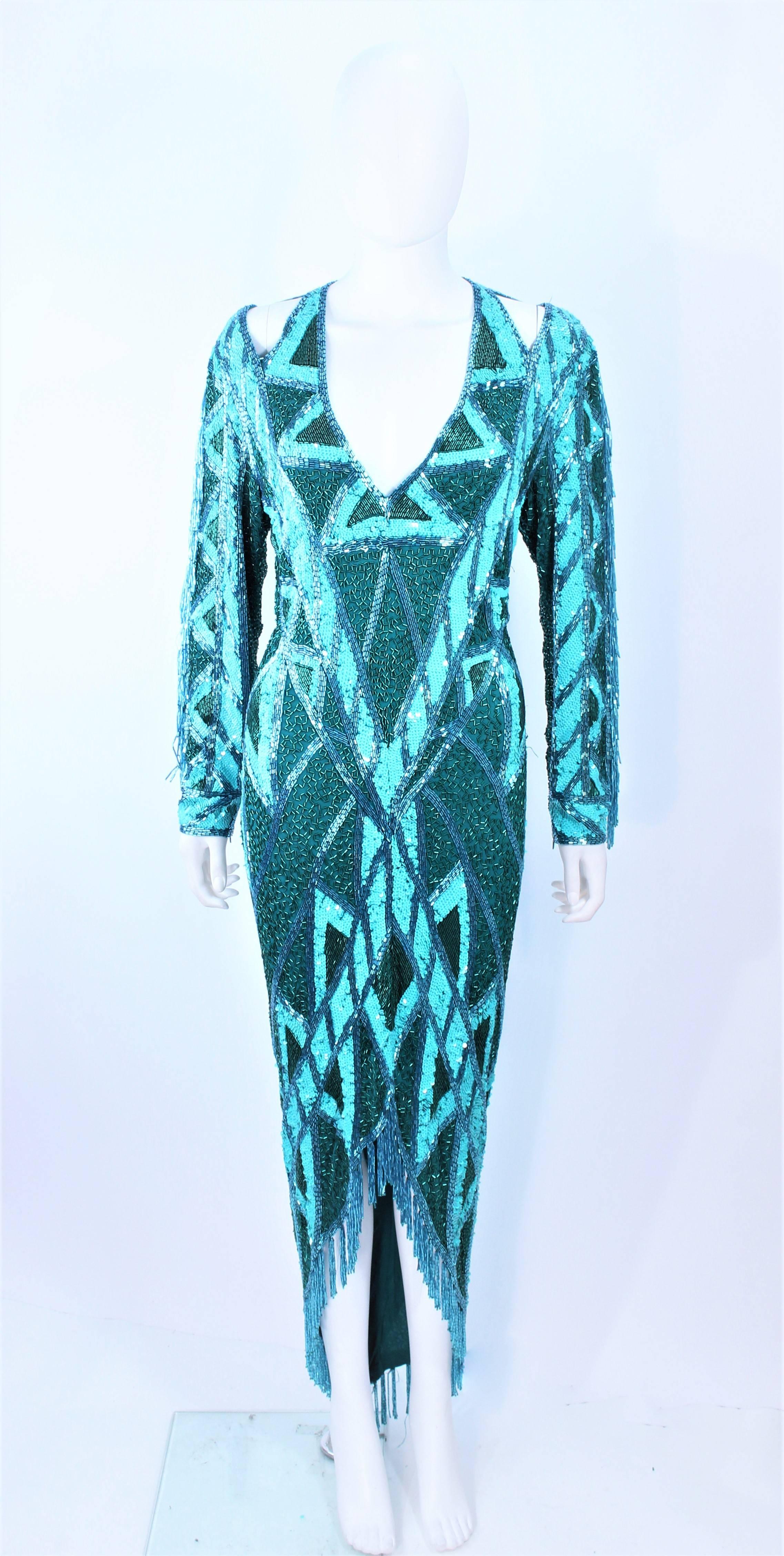 This Bob Mackie gown is composed of a turquoise beaded and sequin silk fabric. Features a low-cut strap back with zipper closure and hook & eyes. In excellent vintage condition.

**Please cross-reference measurements for personal accuracy. Size in