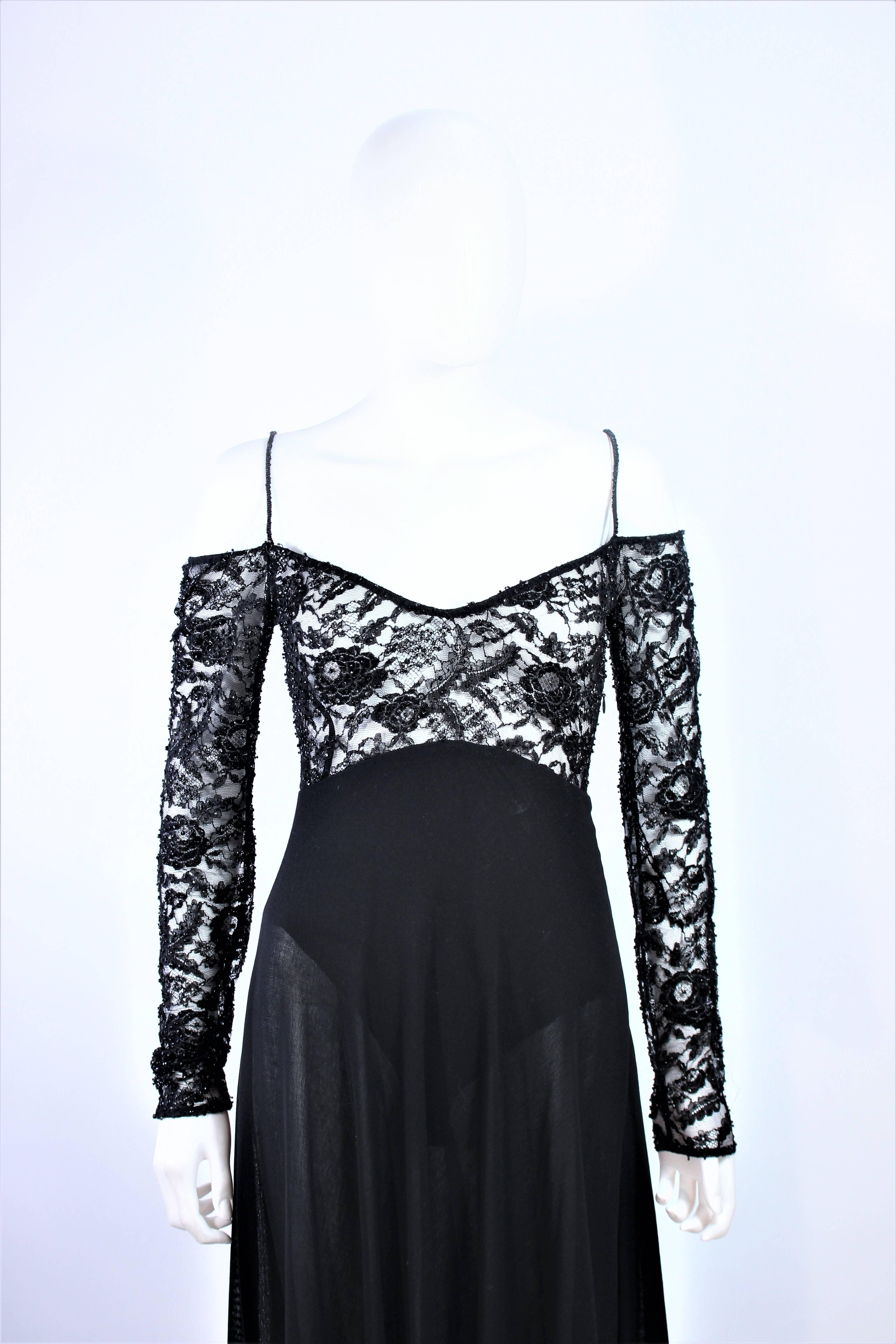 This Donna Karan gown is composed of a black jersey with lace bodice. Features an interior unitard with side zipper closure. In excellent vintage condition.

**Please cross-reference measurements for personal accuracy. Size in description box is