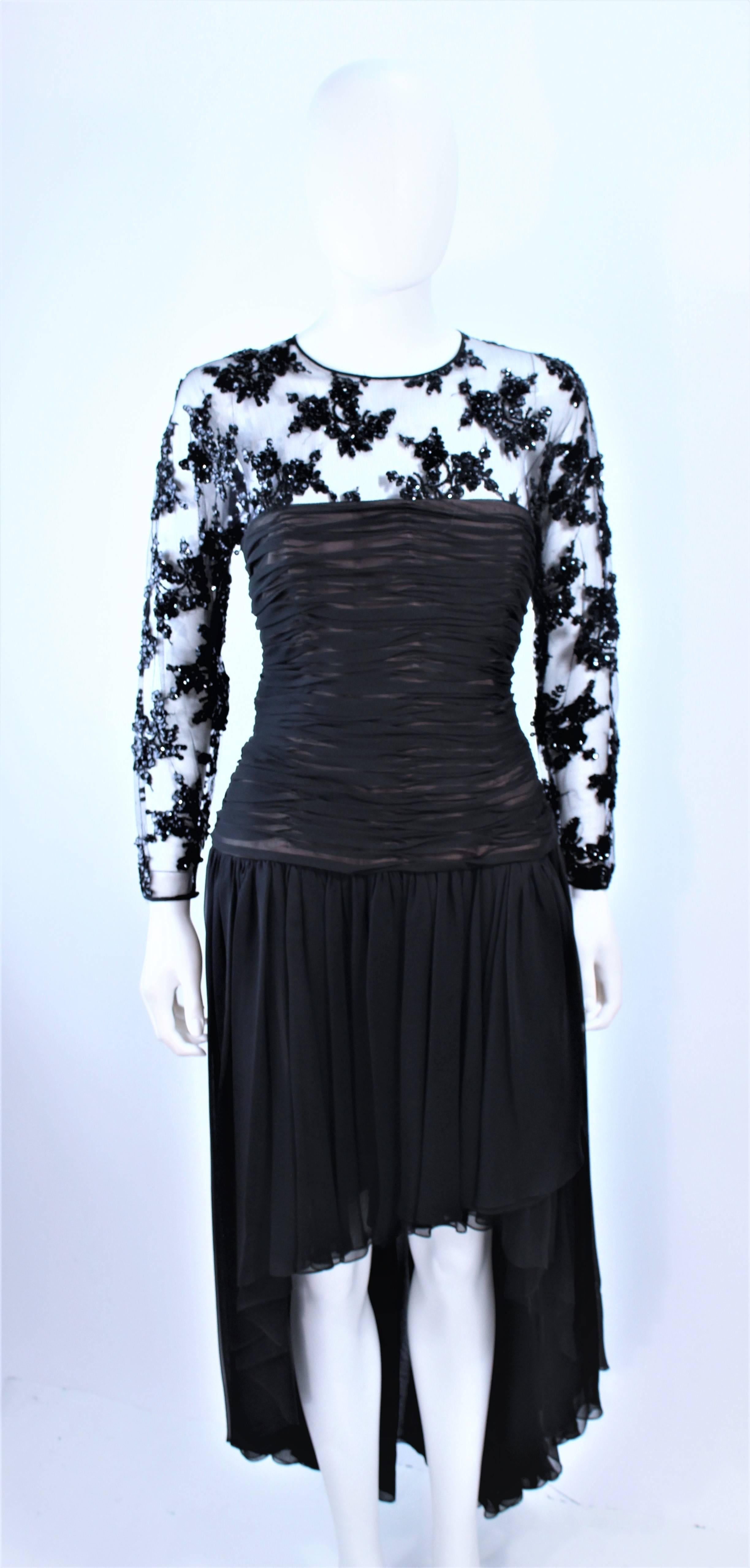 This Oscar De La Renta design is composed of a black chiffon with lace. Features a hi-low skirt with a ruched bodice, and a center back zipper closure. In excellent vintage condition.

**Please cross-reference measurements for personal accuracy.
