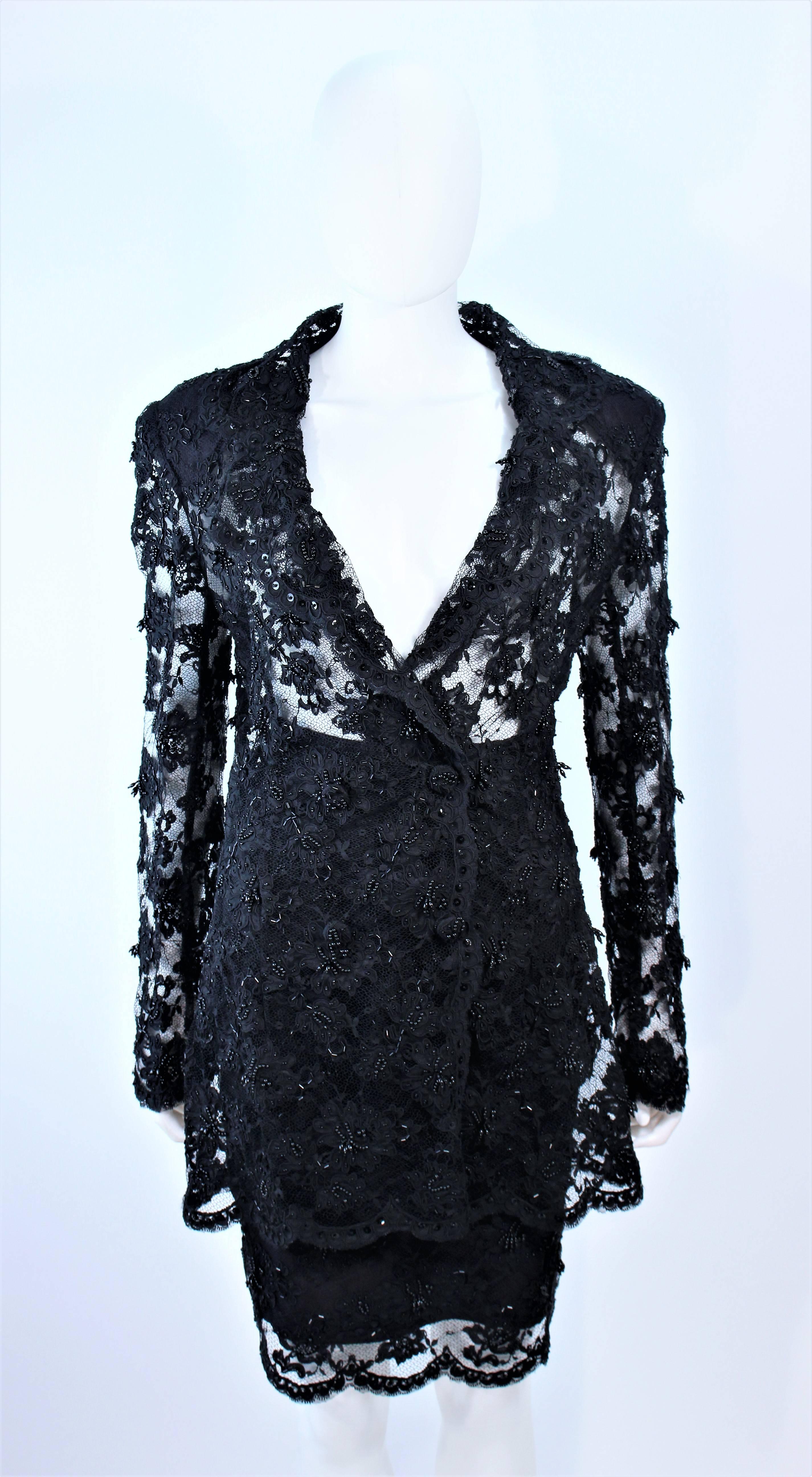 This Fetoun skirt suit is composed of beaded black lace. The jacket features a sheer design with center front snap closures The skirt has a classic pencil style with zipper closure. In excellent vintage condition.

**Please cross-reference
