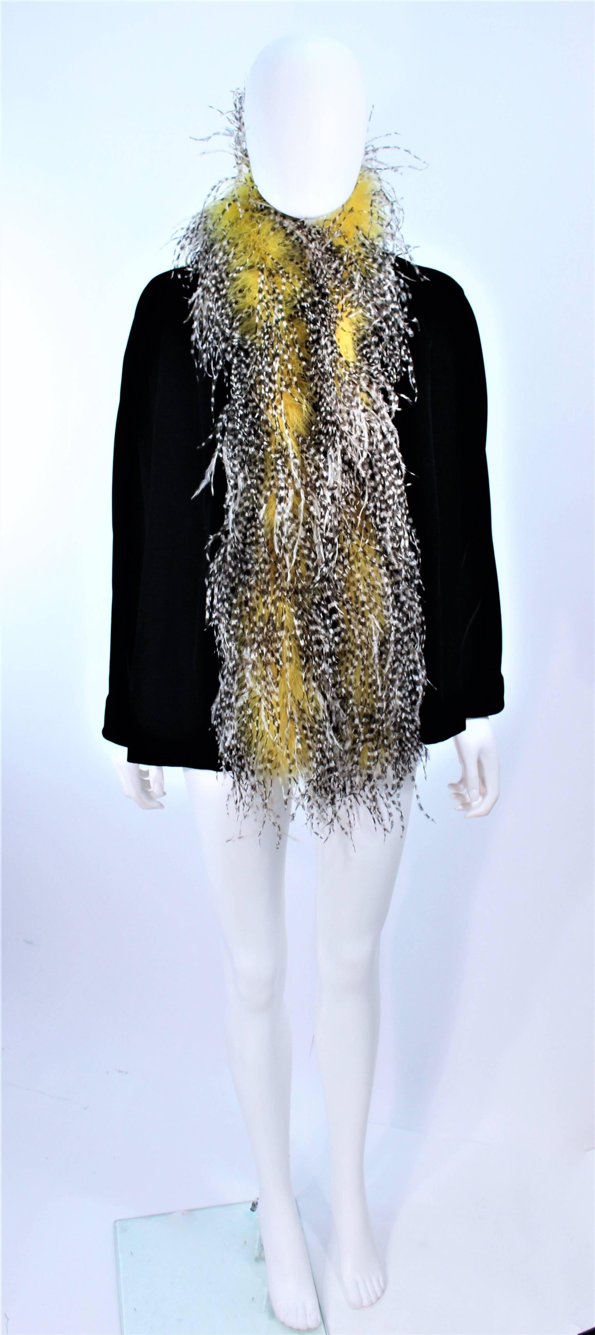 This Frank Tagnino design is composed of a black velvet and features a feather trim, in black, white, and yellow. Open draped style. In excellent pre-owned condition.

**Please cross-reference measurements for personal accuracy. Size in