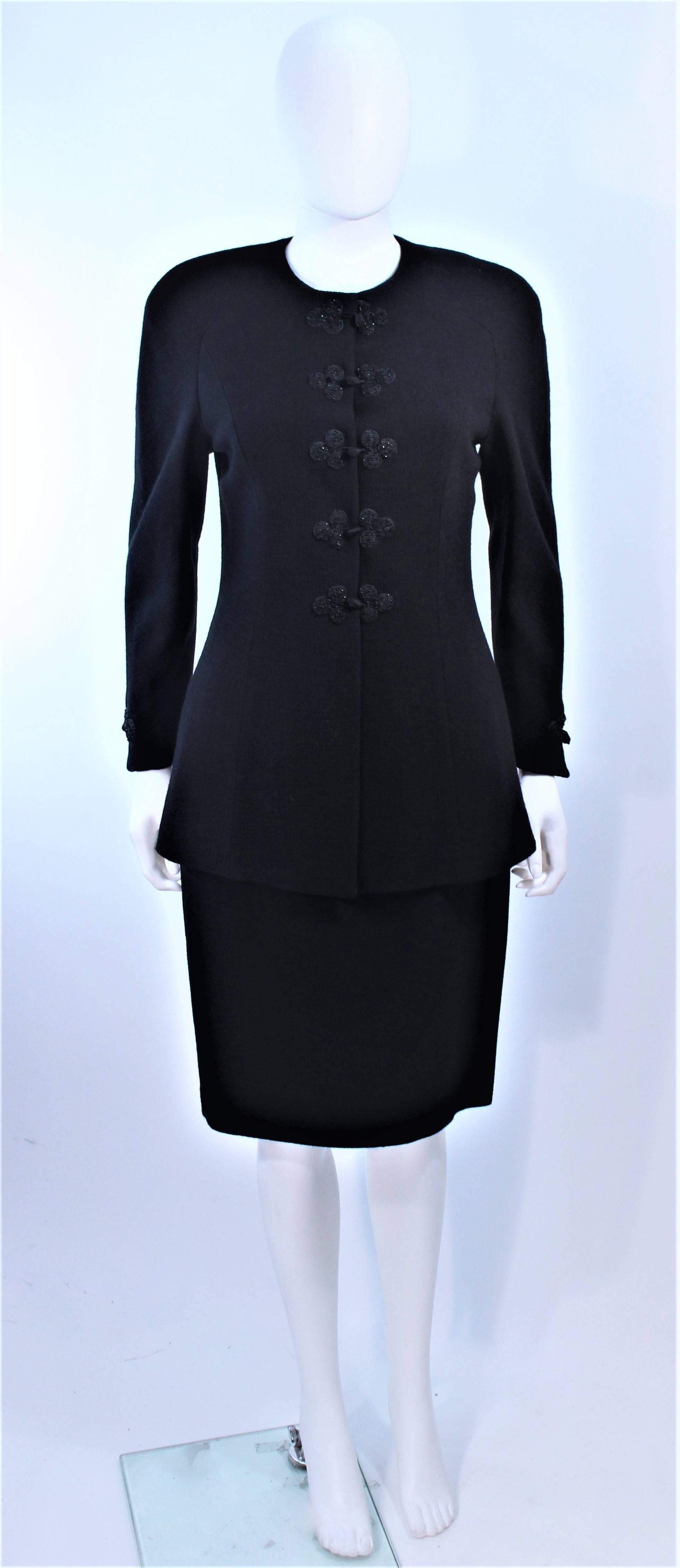 This Valentino skirt suit is composed of a black wool and features beaded button details. There is a classic style pencil skirt with zipper closure. In excellent pre-owned condition.

**Please cross-reference measurements for personal accuracy.
