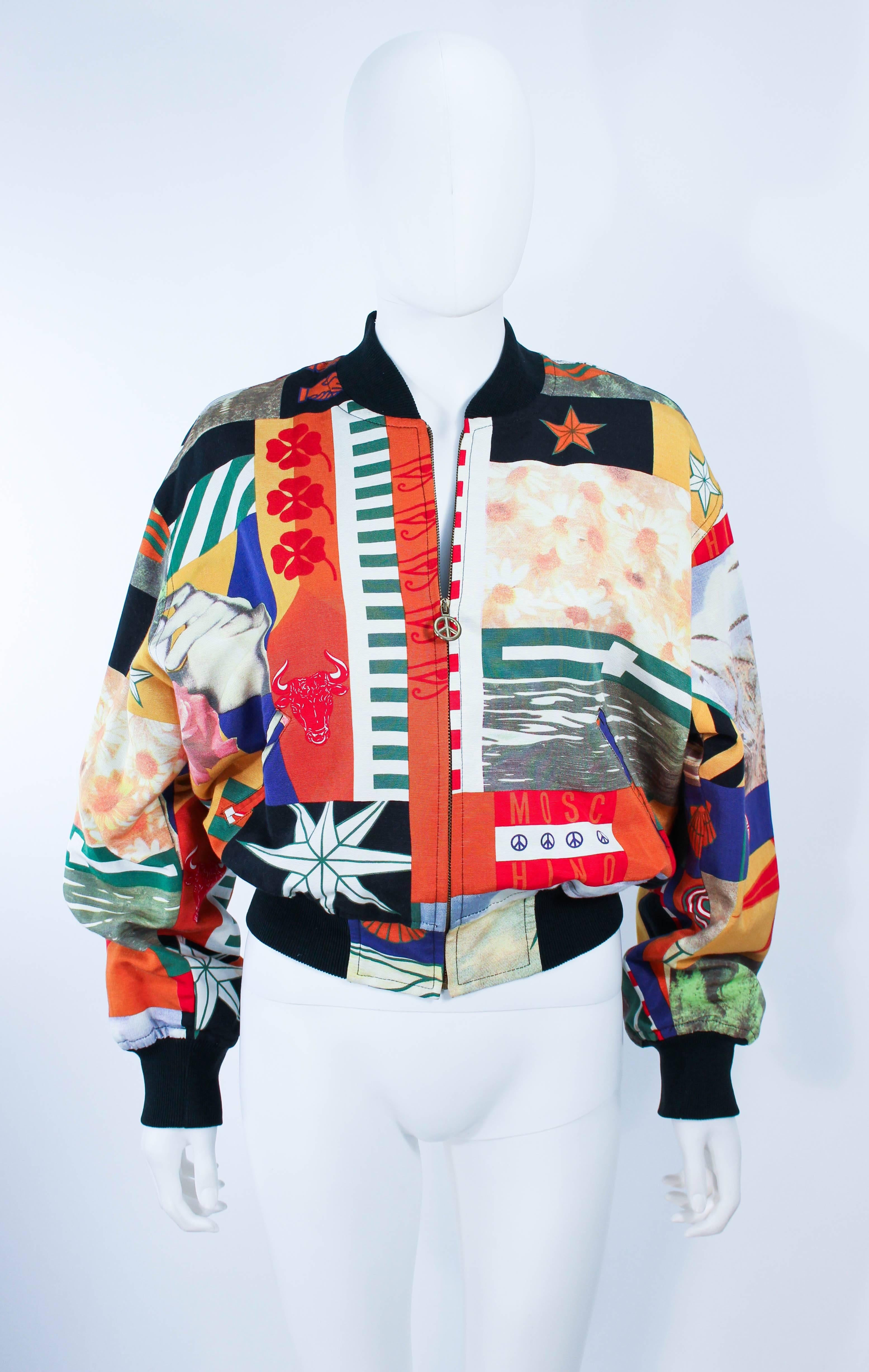 This Moschino bomber jacket is composed of an abstract printed silk. Features a classic bomber style with side pockets and a peace sign zipper closure. In excellent vintage condition.

**Please cross-reference measurements for personal accuracy.