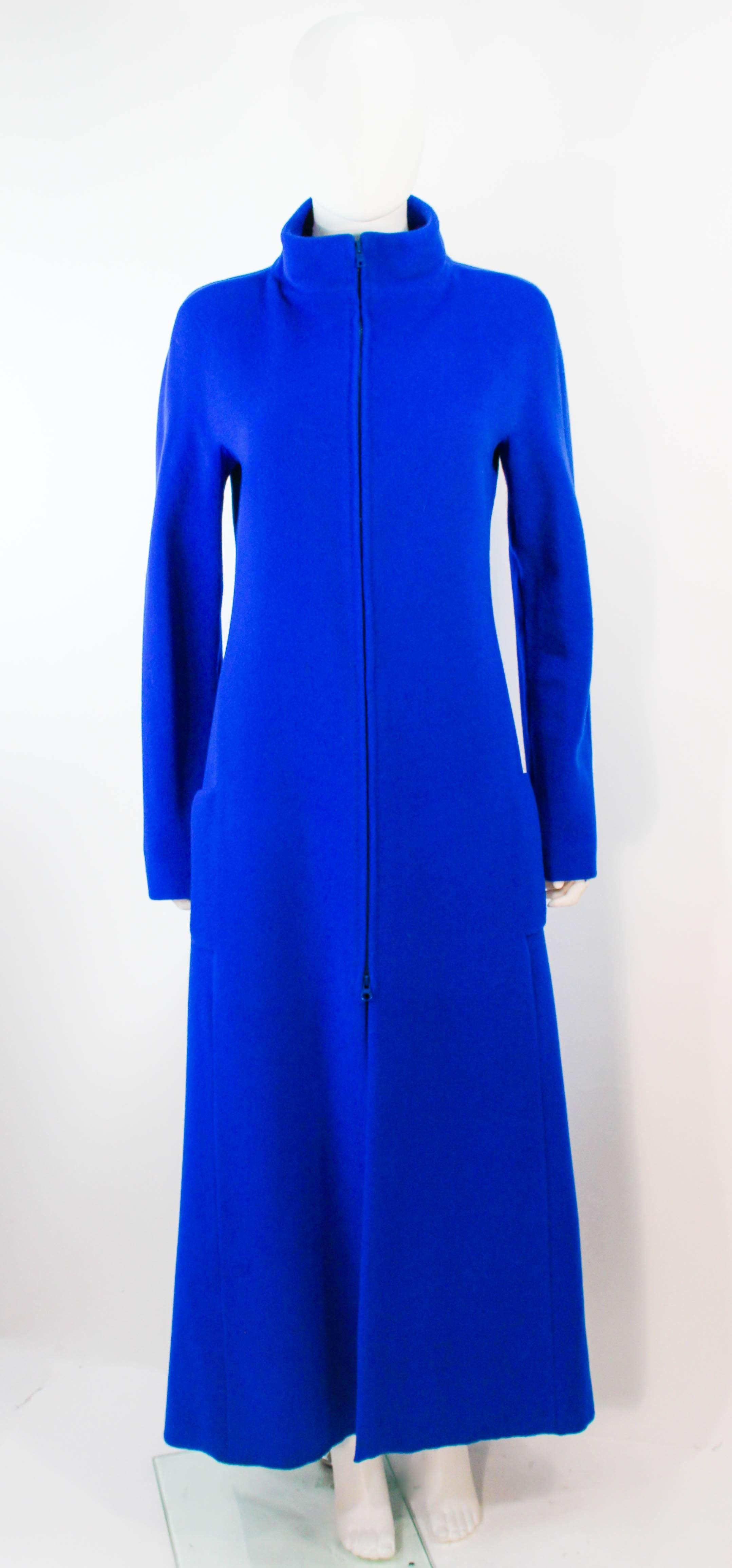 This Krizia design is composed of a rich royal blue wool. Features a center front double ended zipper with side pockets. In excellent vintage condition, some small moth hole throughout.

**Please cross-reference measurements for personal accuracy.