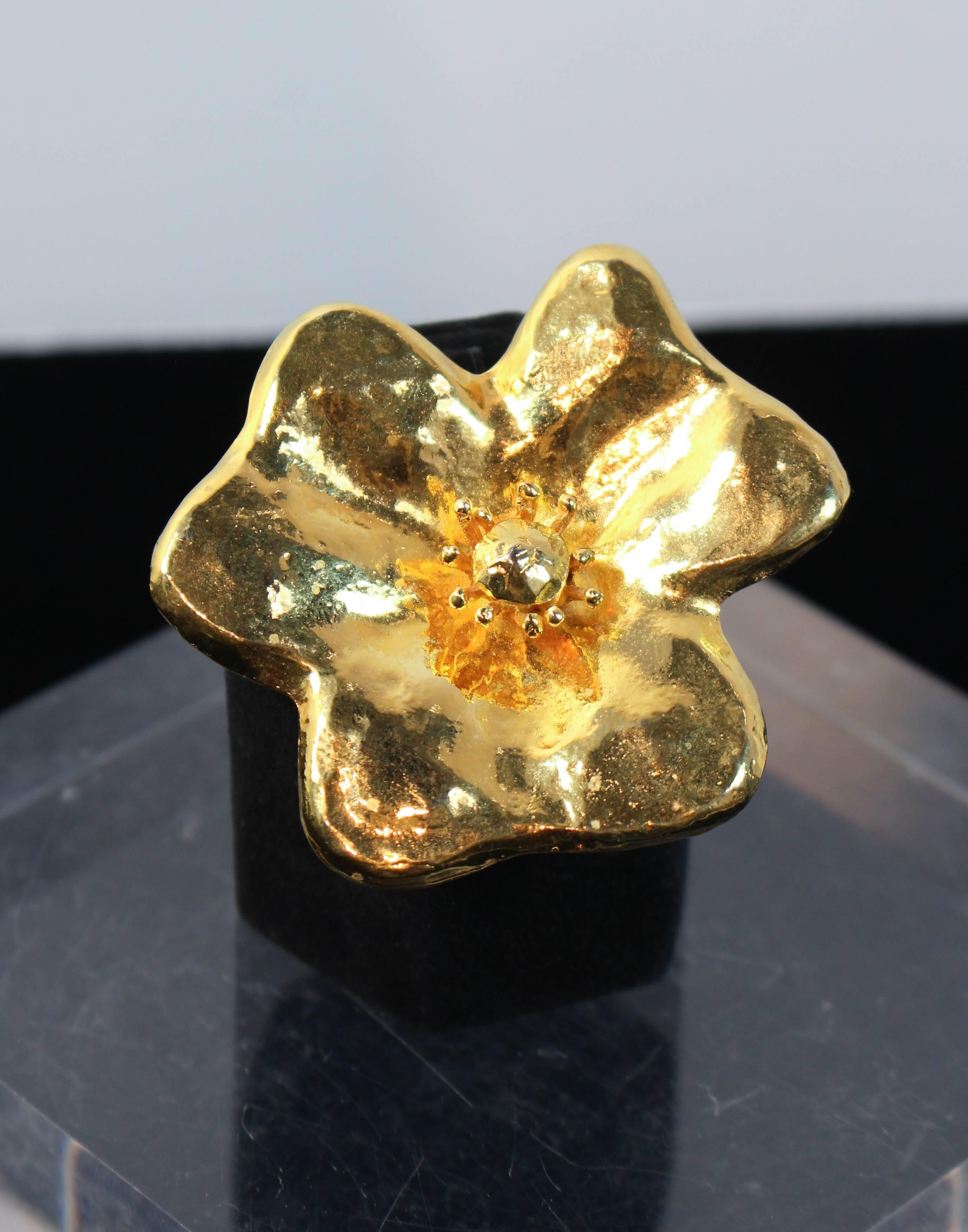 This Yves Saint Laurent Rive Gauche brooch is composed of a stunning gold tone metal. A lovely textured floral design. In excellent vintage condition.

**Please cross-reference measurements for personal accuracy. Size in description box is an