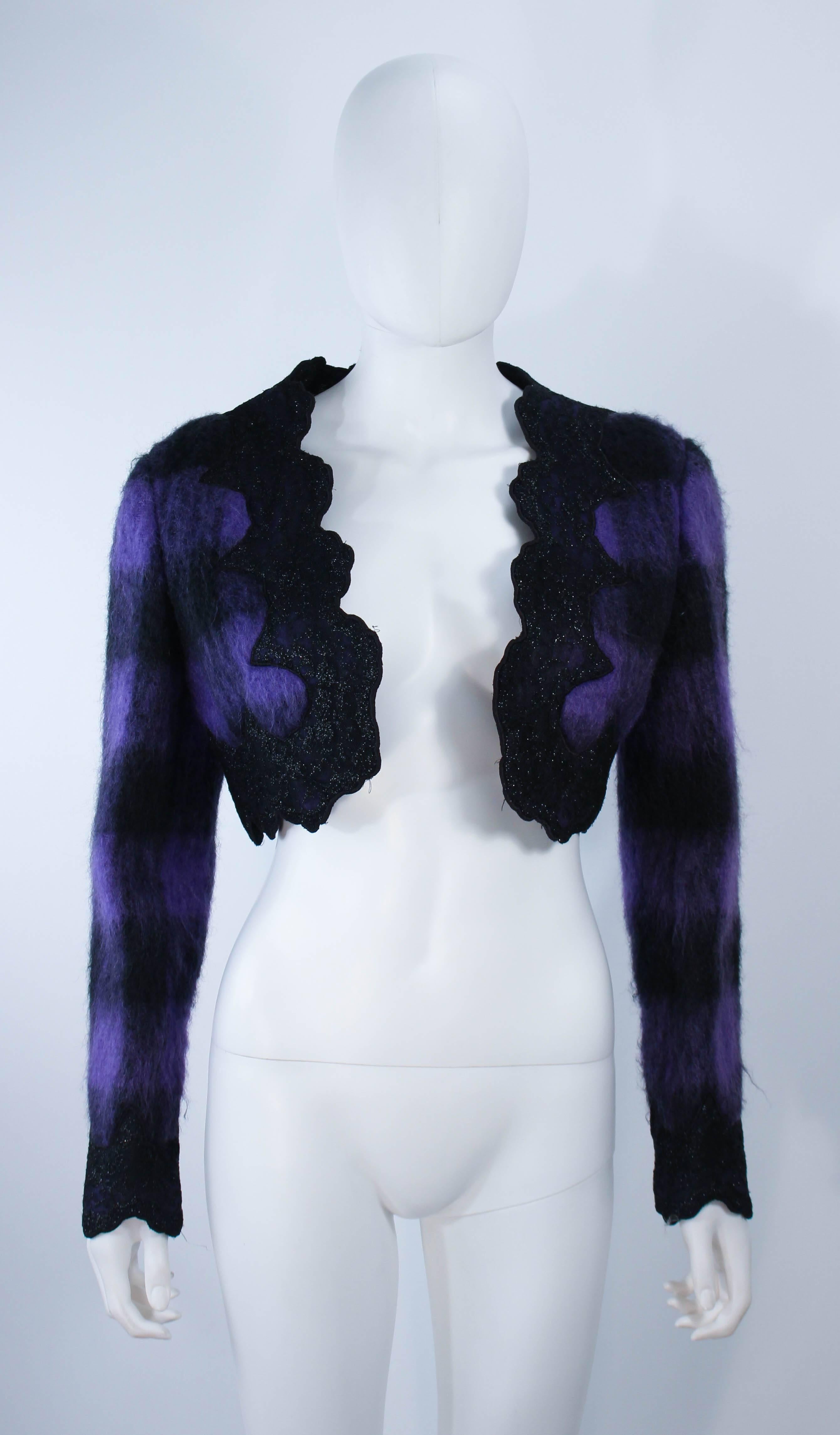 This Mr. Beene jacket is composed of a purple plaid patterned mohair with black lace metallic trim. Features an open bolero style. In excellent vintage condition.

**Please cross-reference measurements for personal accuracy. Size in description box