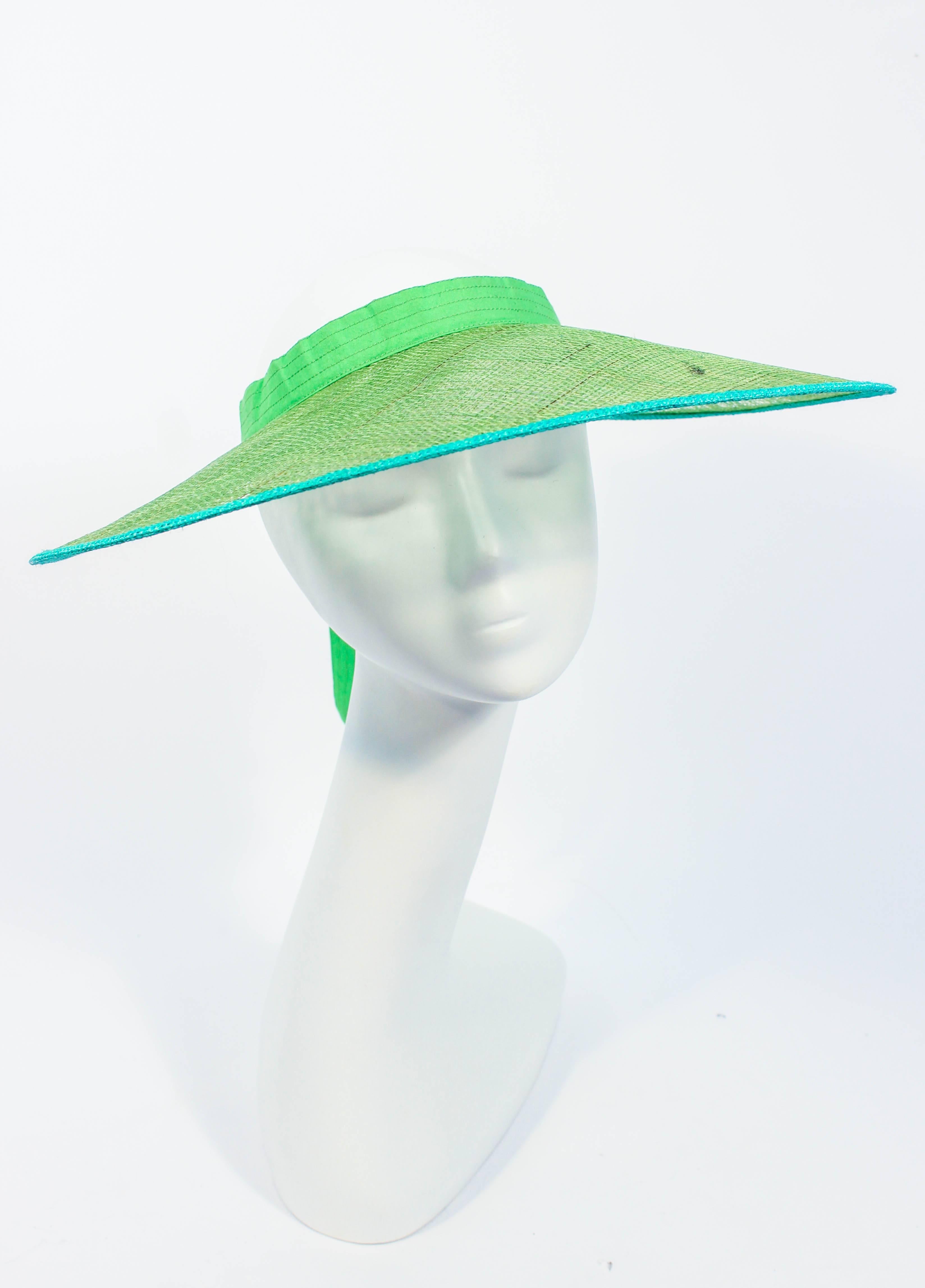 This Yves Saint Laurent hat is composed of green mesh. Features a tie back. Made in France. In excellent vintage condition.

This YSL hat is from an extensive collection I acquired from the estate of a very wealthy lady who chose to live in Paris